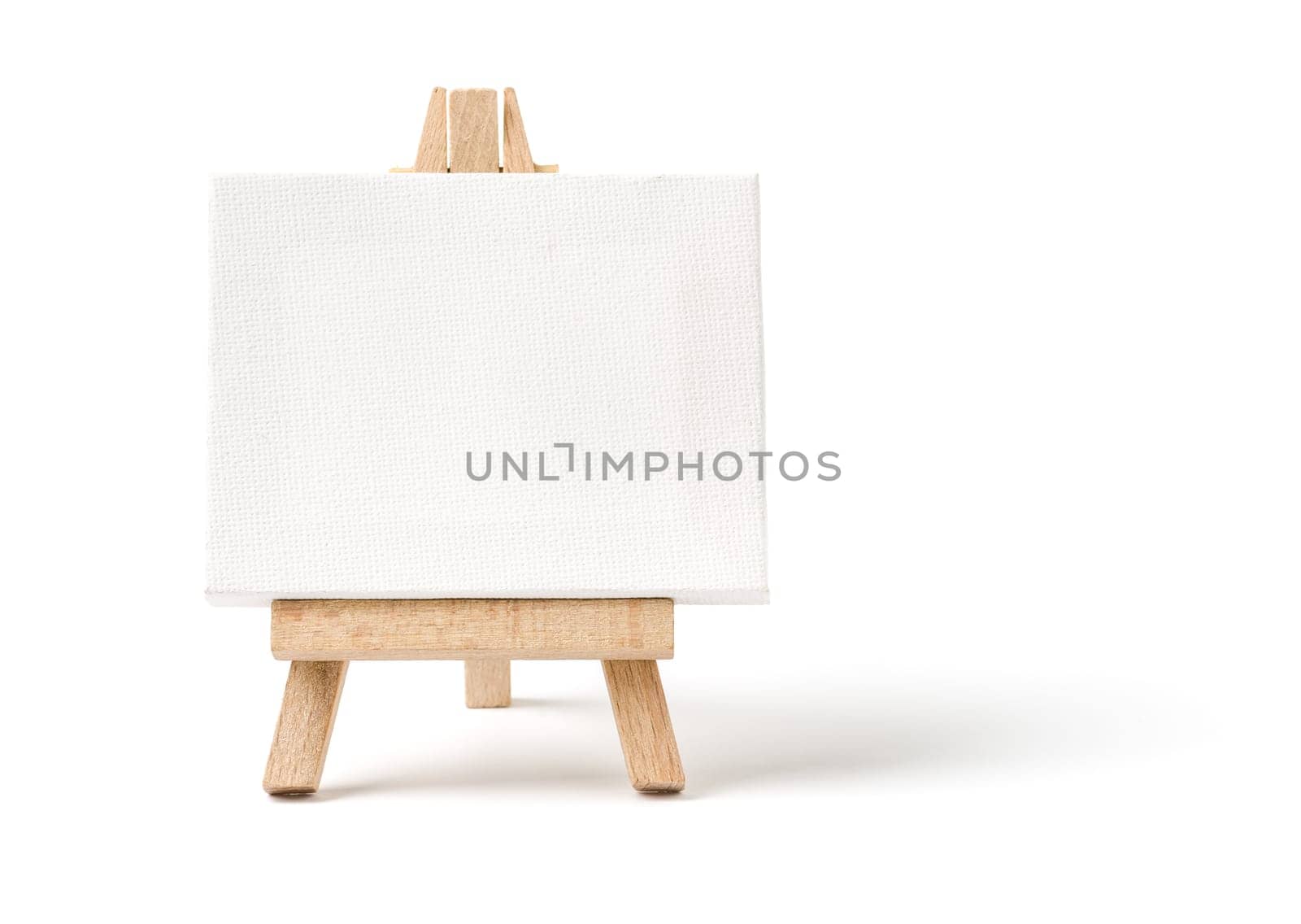 Easel with empty canvas against a white background