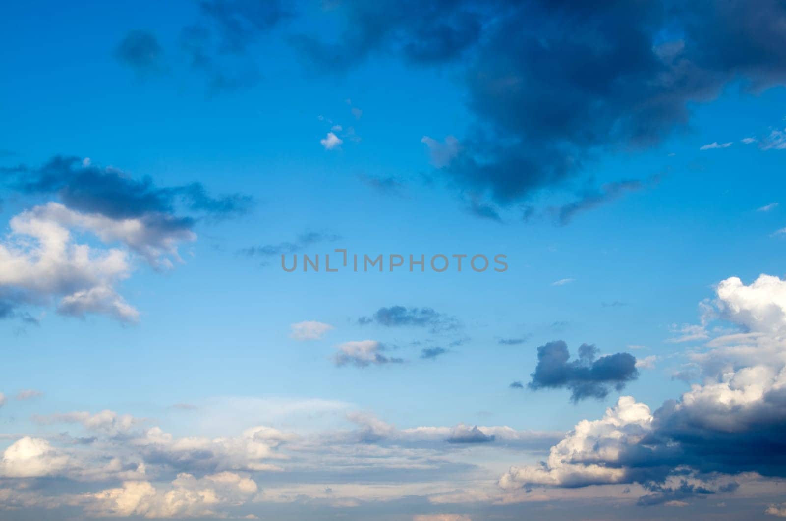 Blue sky background with a tiny clouds