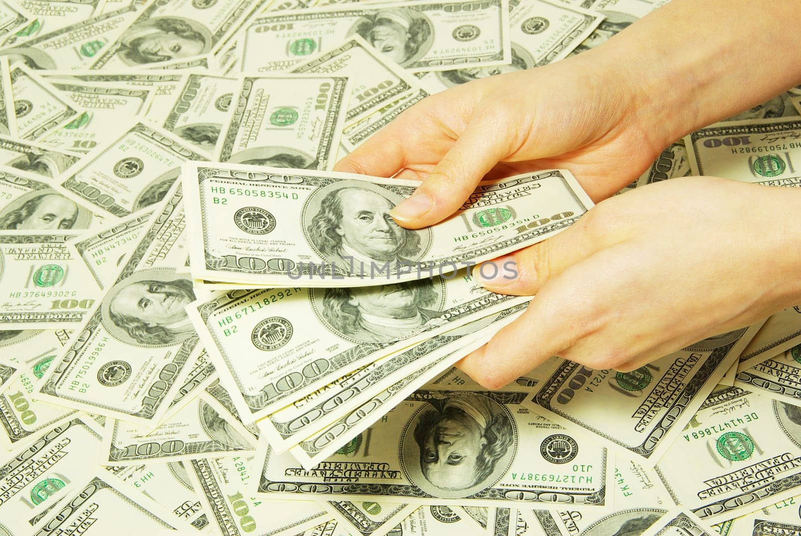 Hand with money isolated on money background