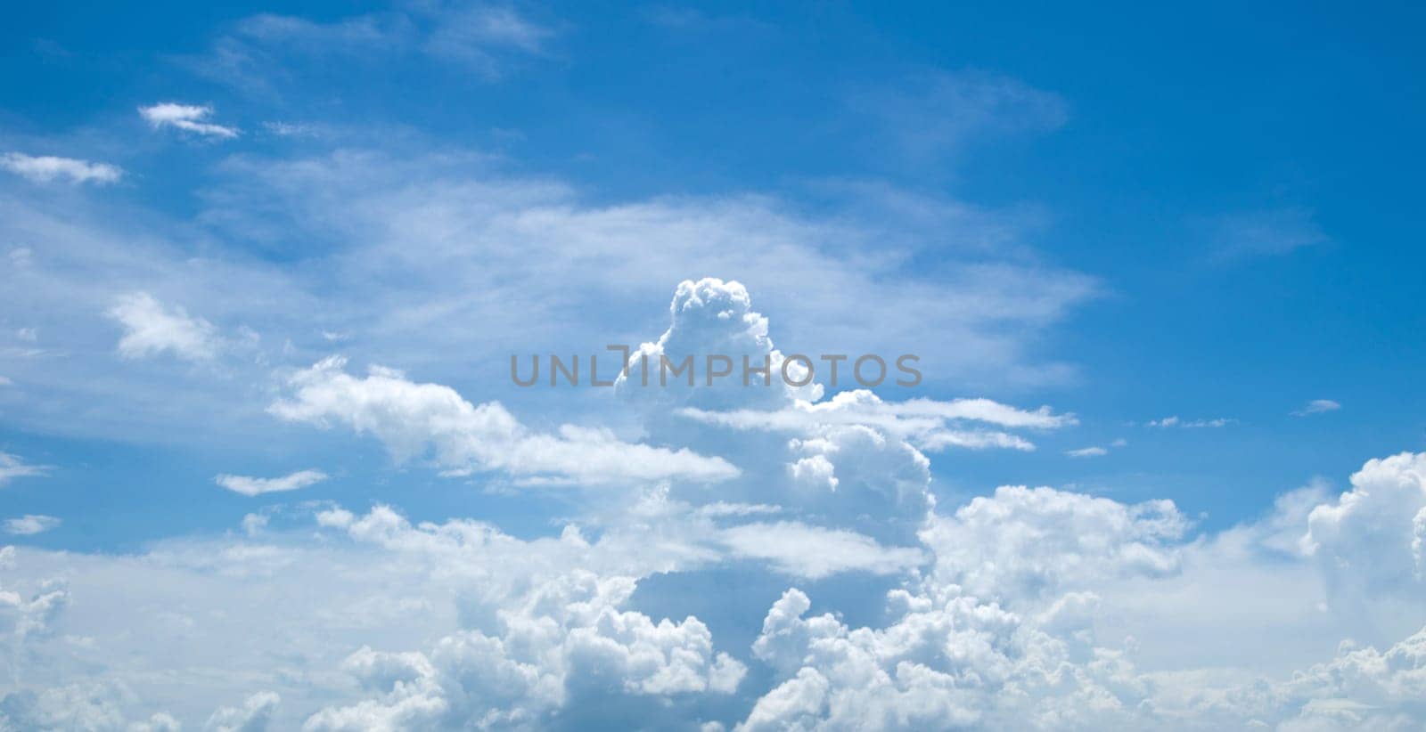 blue sky background with tiny clouds