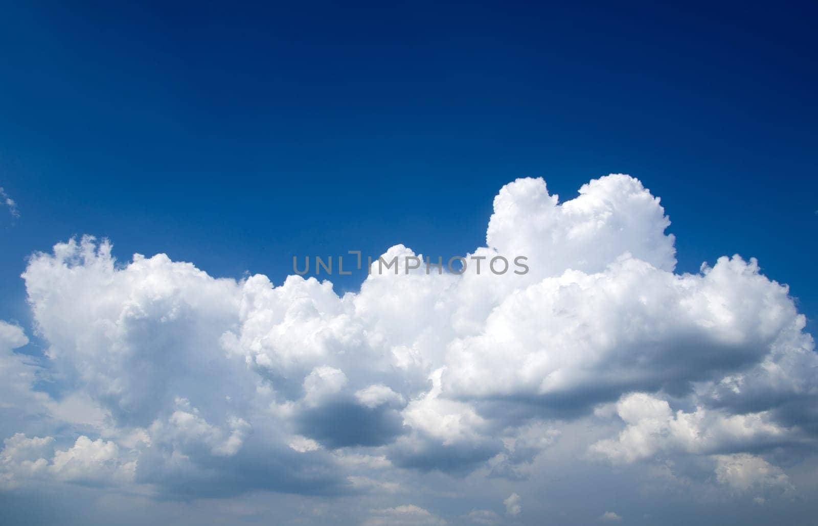 blue sky background with tiny clouds