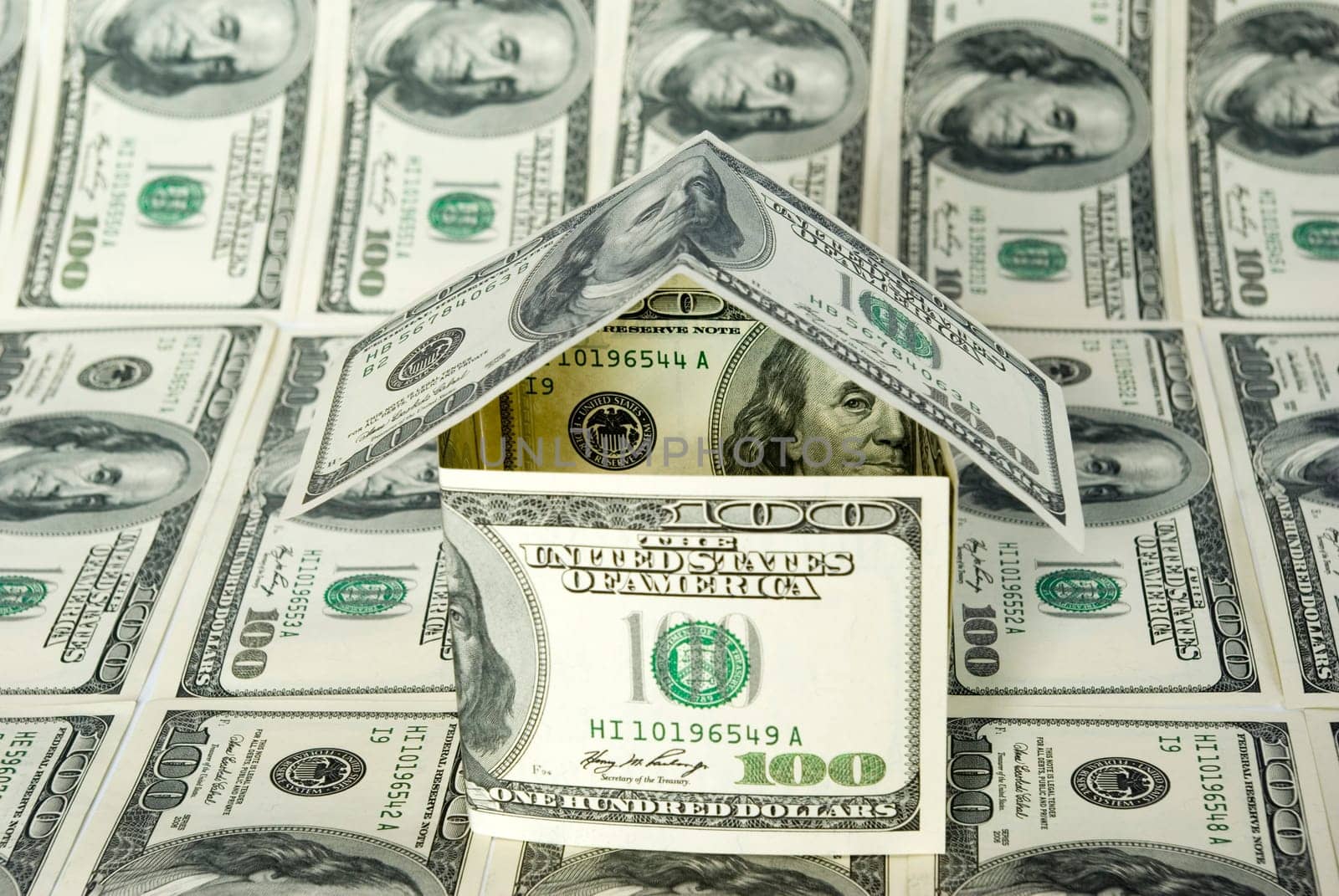Money house on dollars background