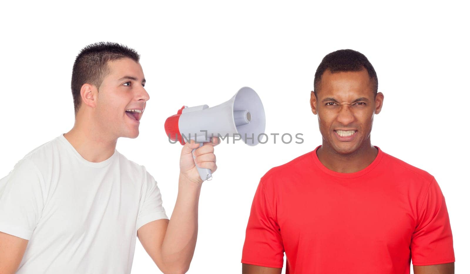 Young men screams to his angry friend through a megaphone isolated on a white background
