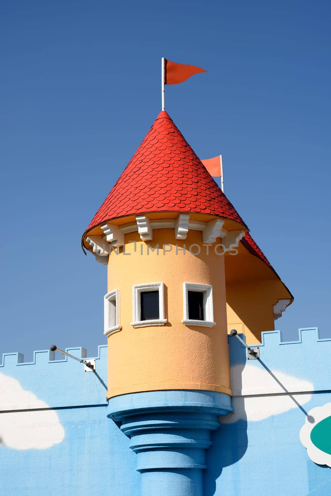 amusement park castle on the blue sky background