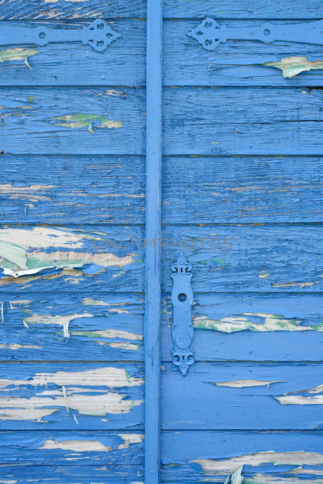 old wooden blue gate with metal handle