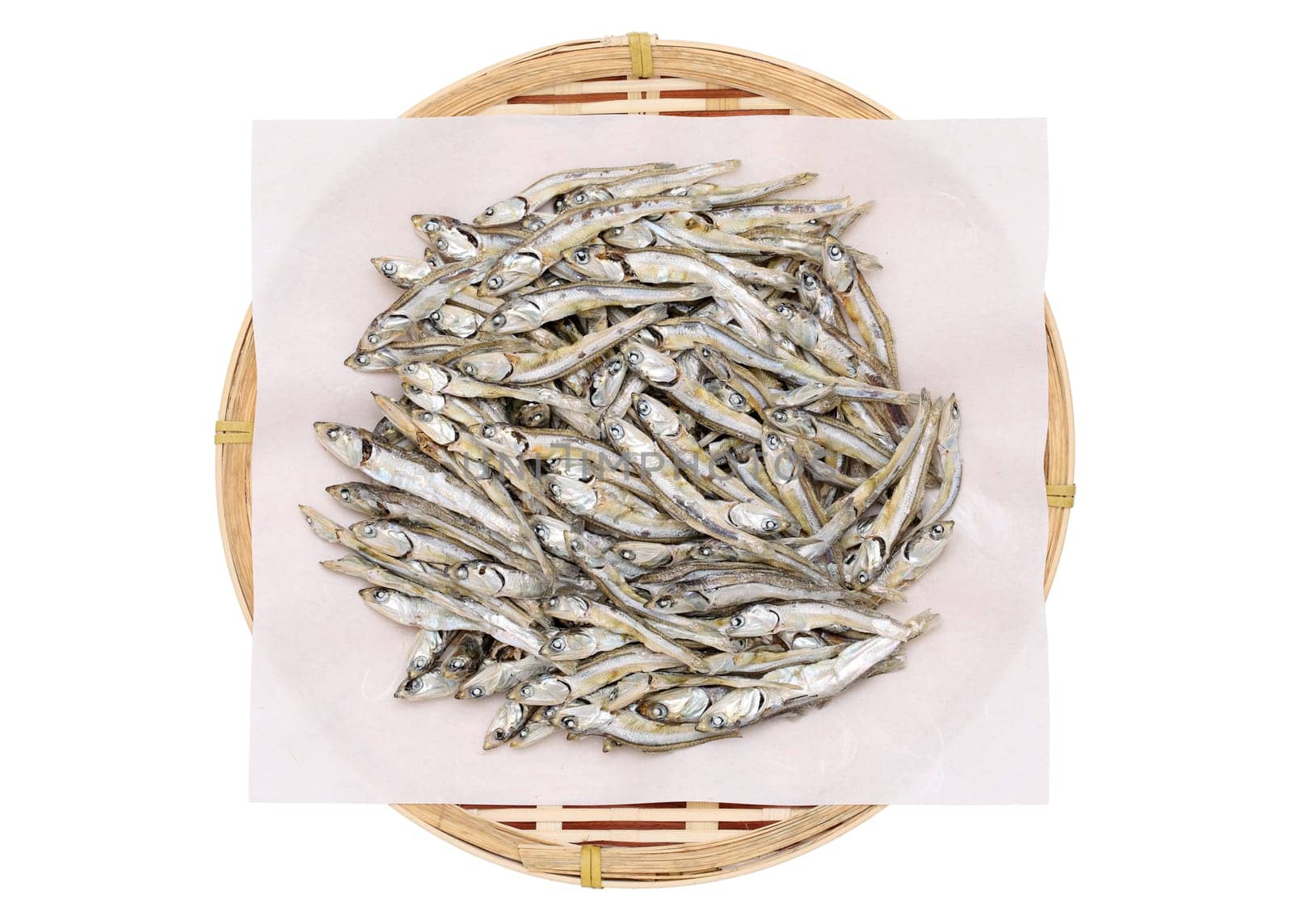 Dried small fish on bamboo basket
