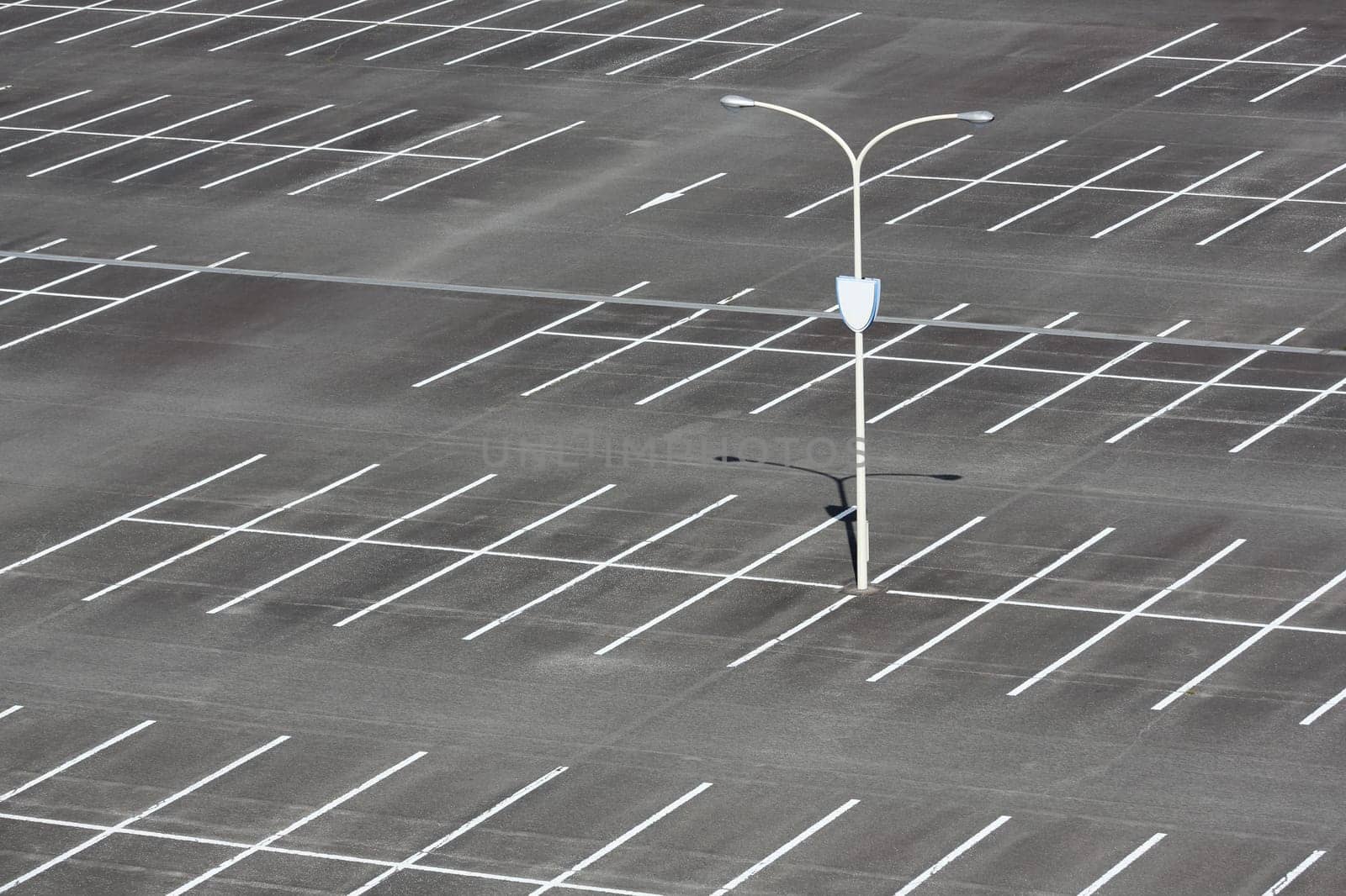 Empty car parking lot with light pole