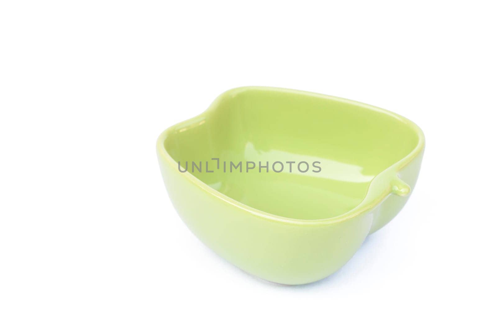Green ceramic bowl isolated on white background, stock photo