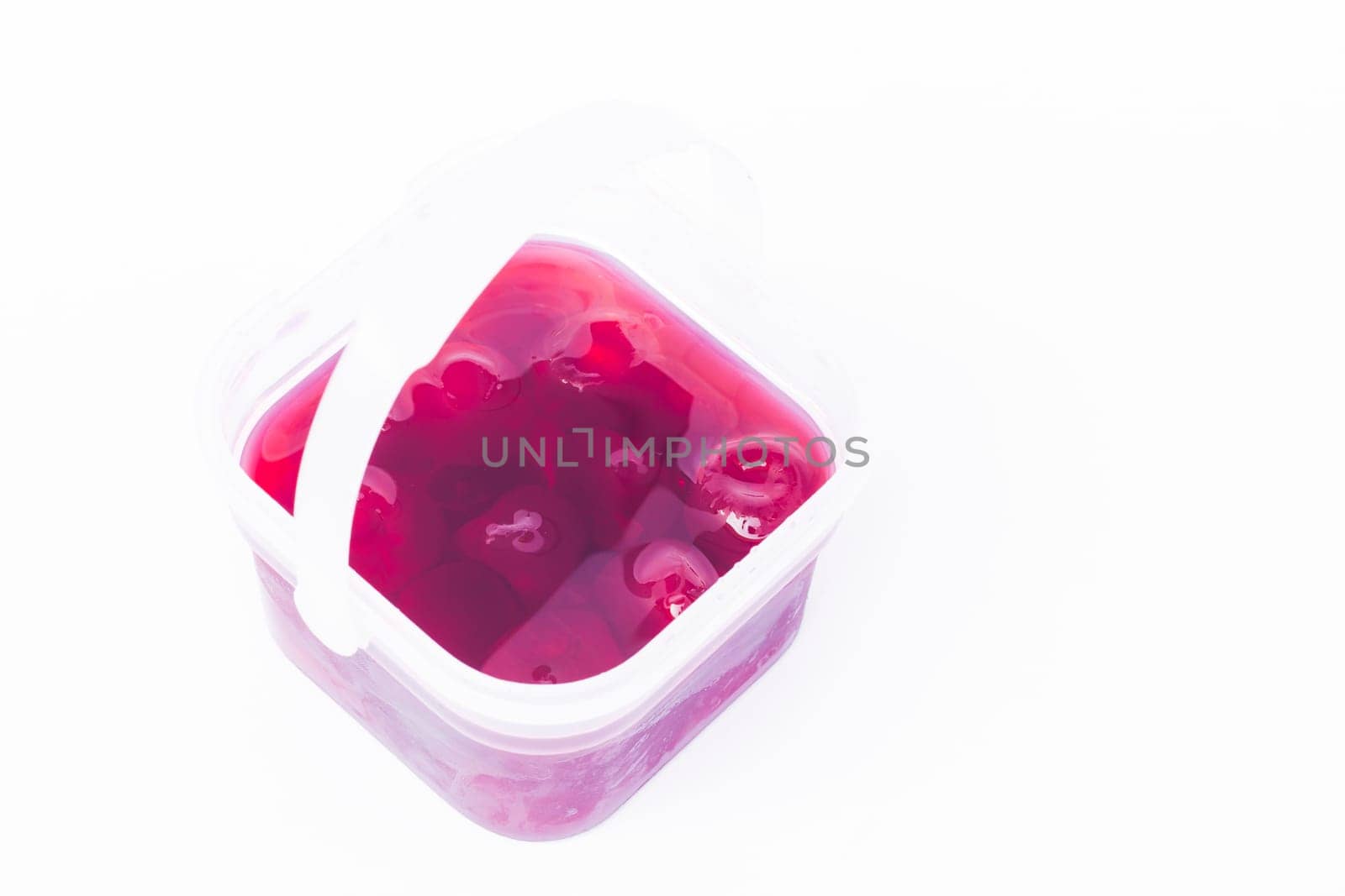 Homemade cherry syrup isolated on white background, stock photo