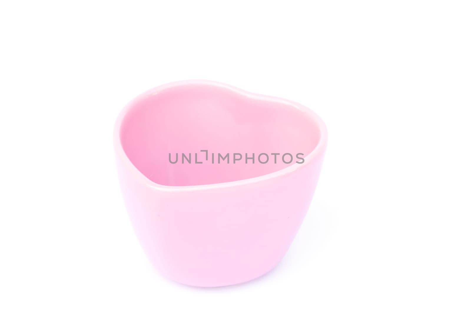 Pink ceramic bowl isolated on white background, stock photo