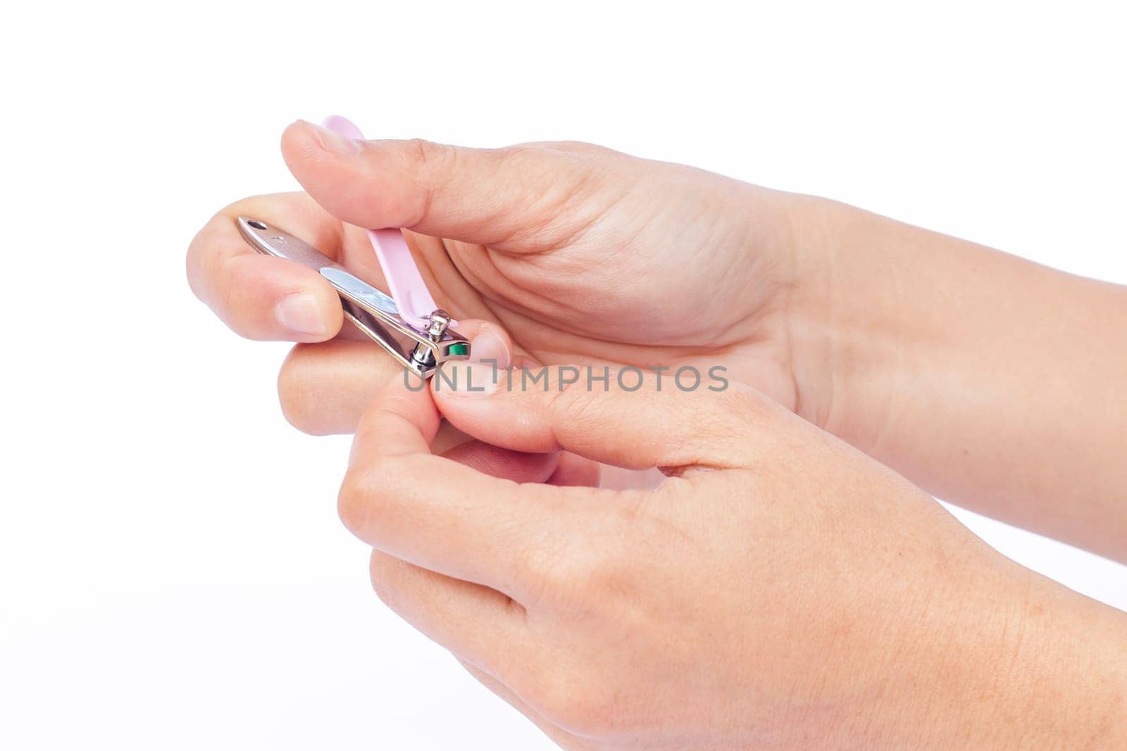 Hand doing cutting with nail clipper, stock photo