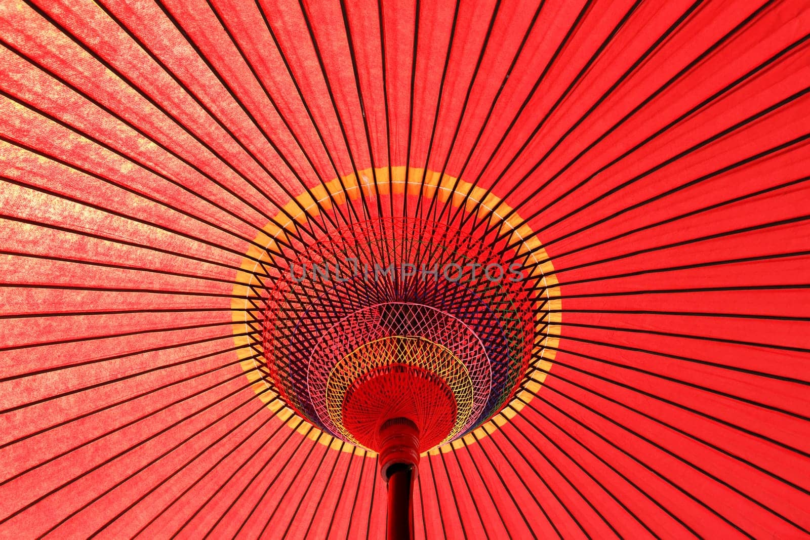 Design underneath the red Japanese umbrella