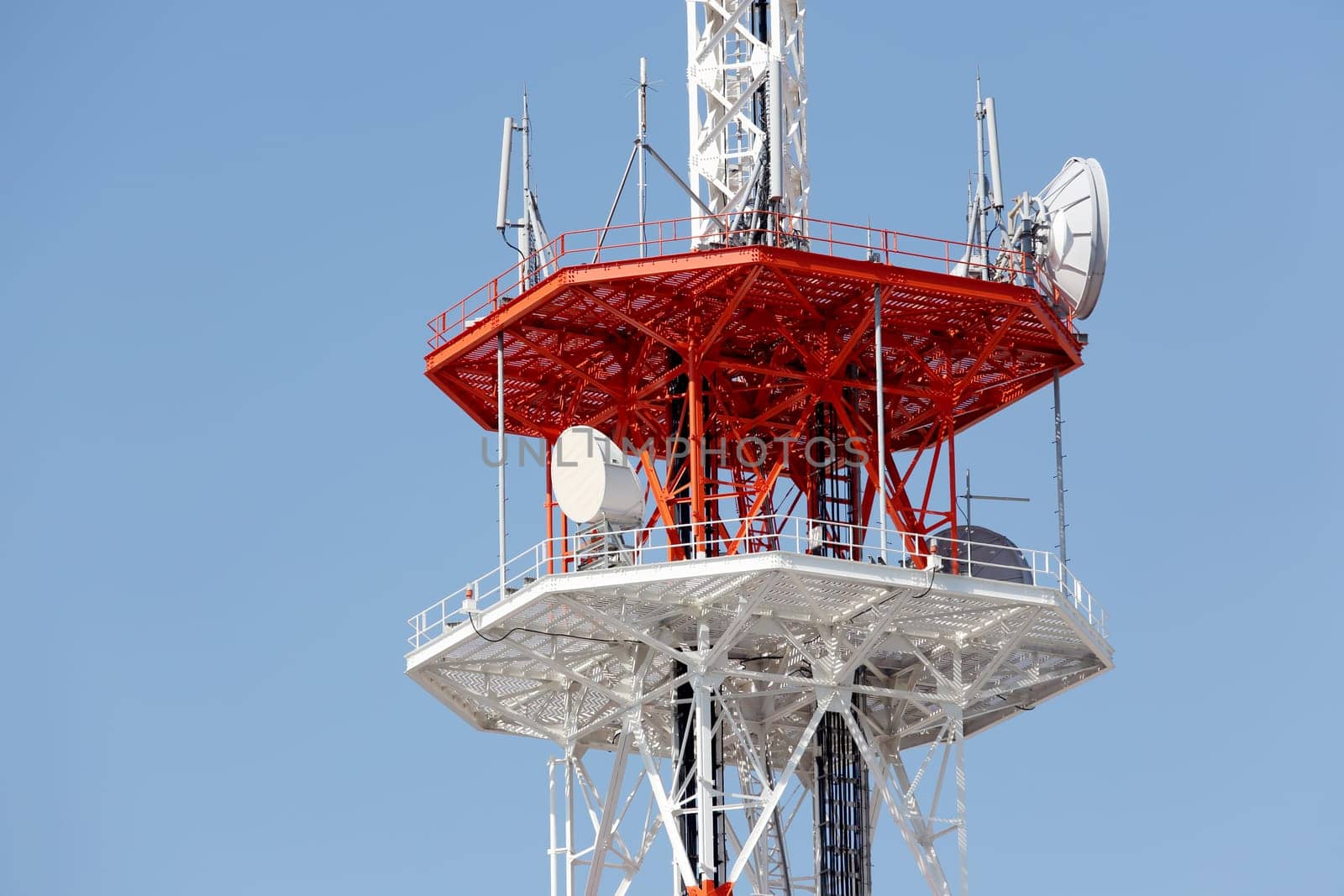 View of communications tower against blue sky
