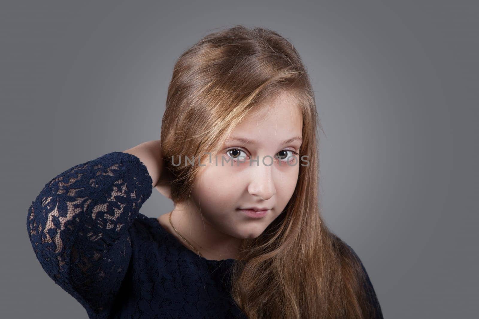 Portrait of a 10 year old girl, studio shot.