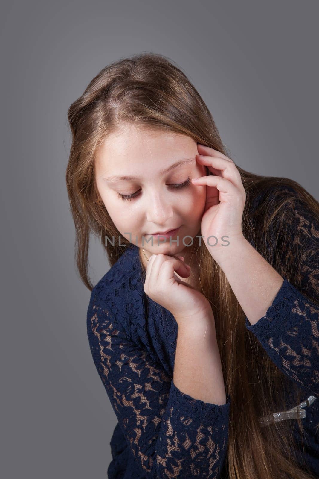 Portrait of a 10 year old girl, studio shot.