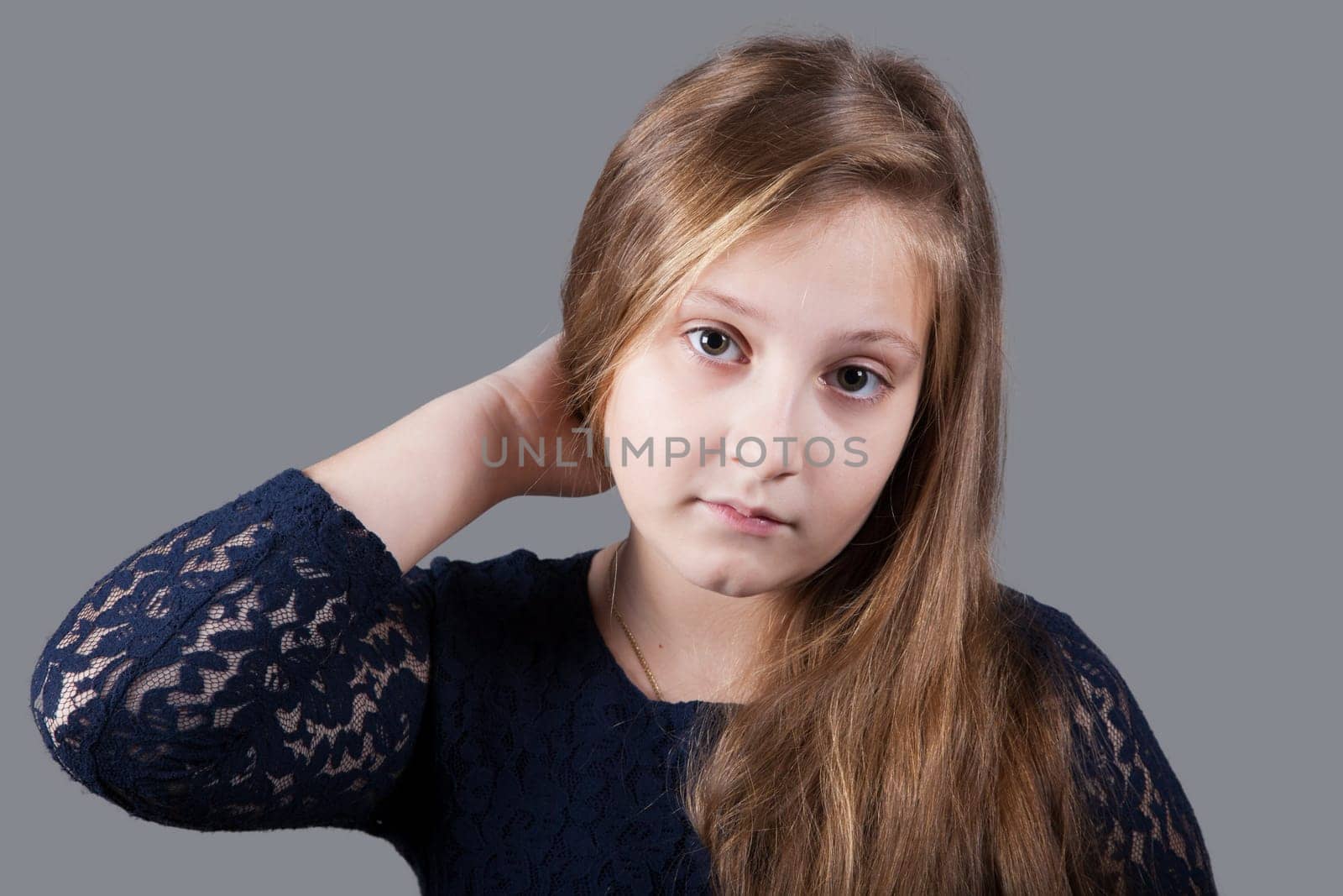 Portrait of a 10 year old girl, studio shot.