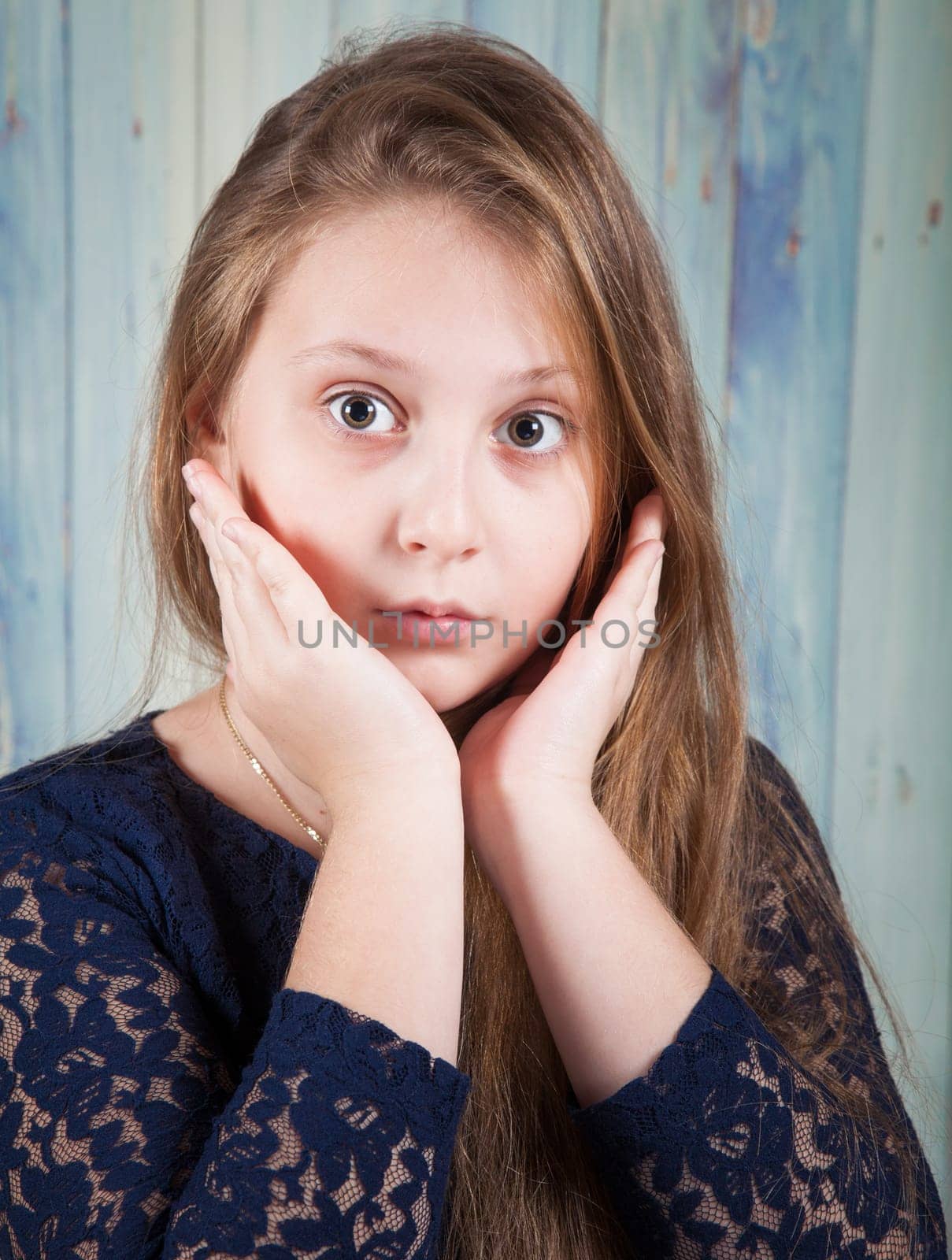 Portrait of a 10 year old girl, studio shot.