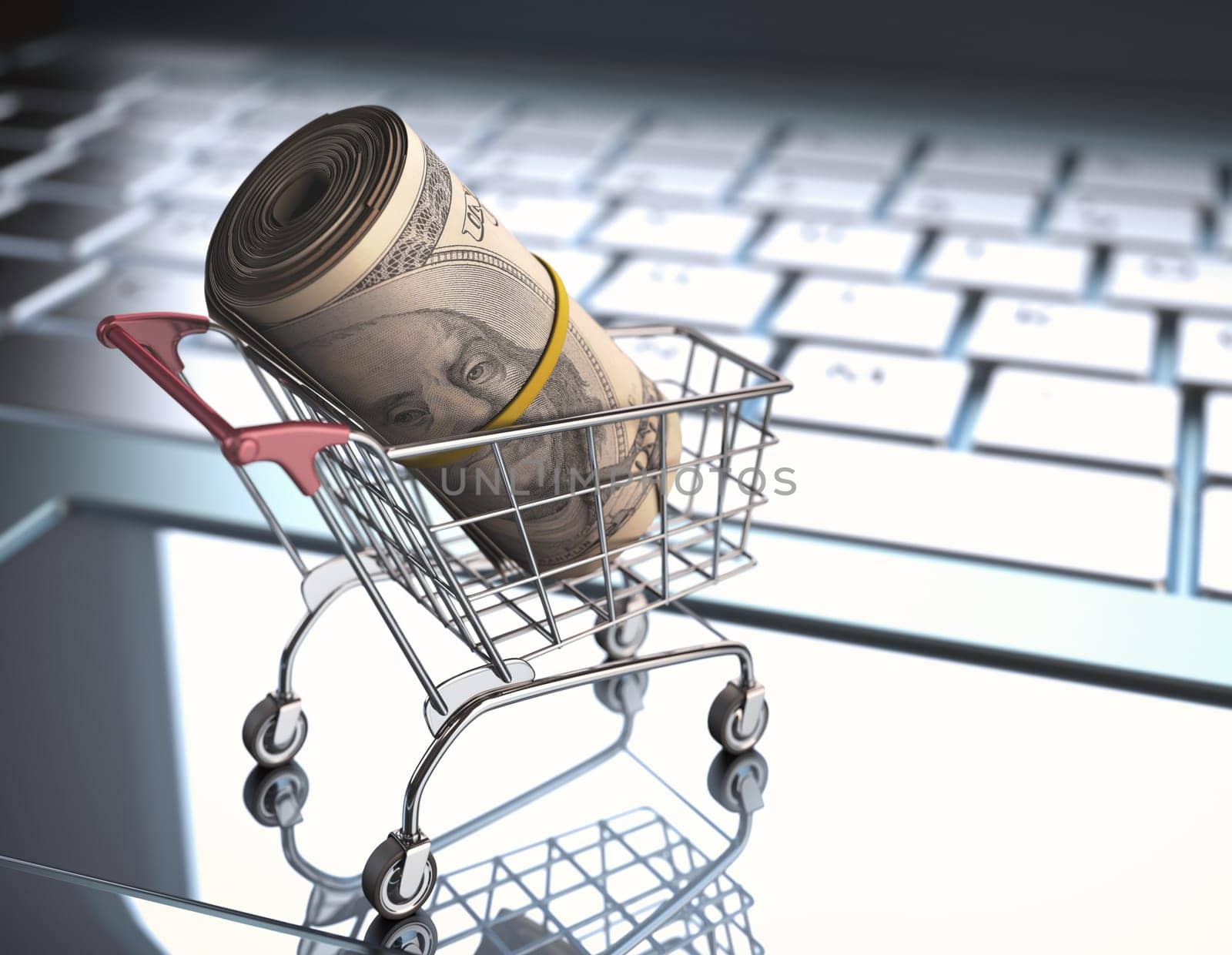 A roll of dollar bills in a shopping cart over a laptop keyboard.