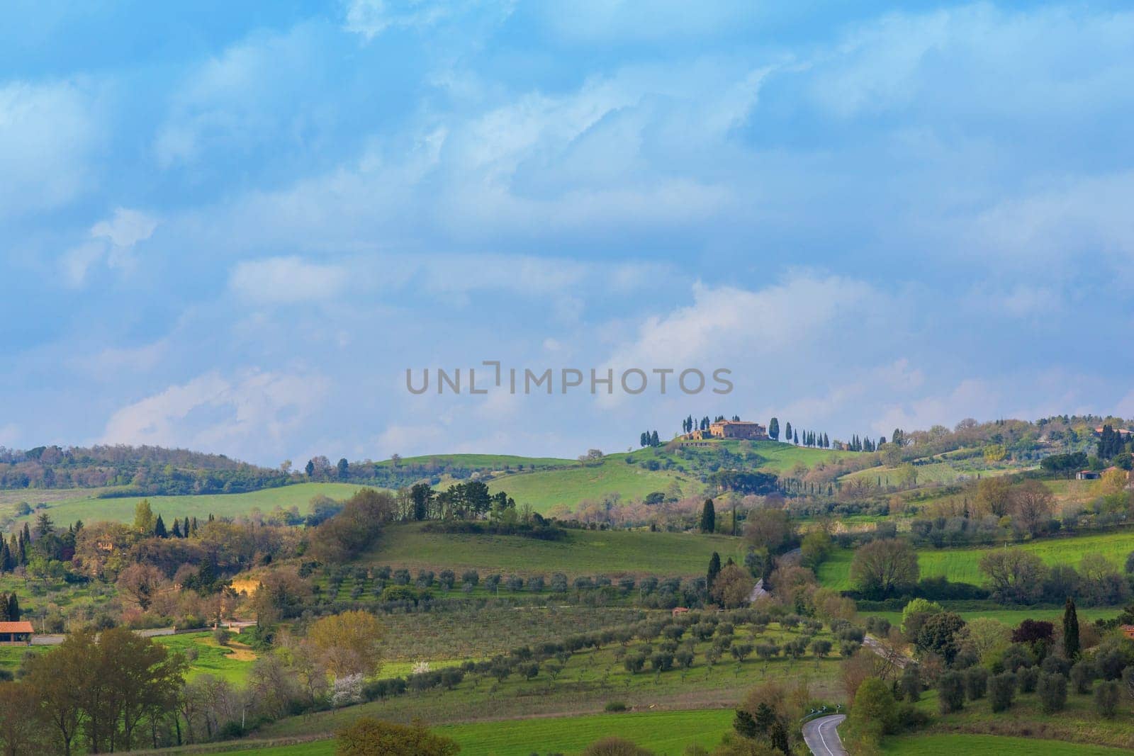 Typical Tuscan countryside with cypresses and farmhouses