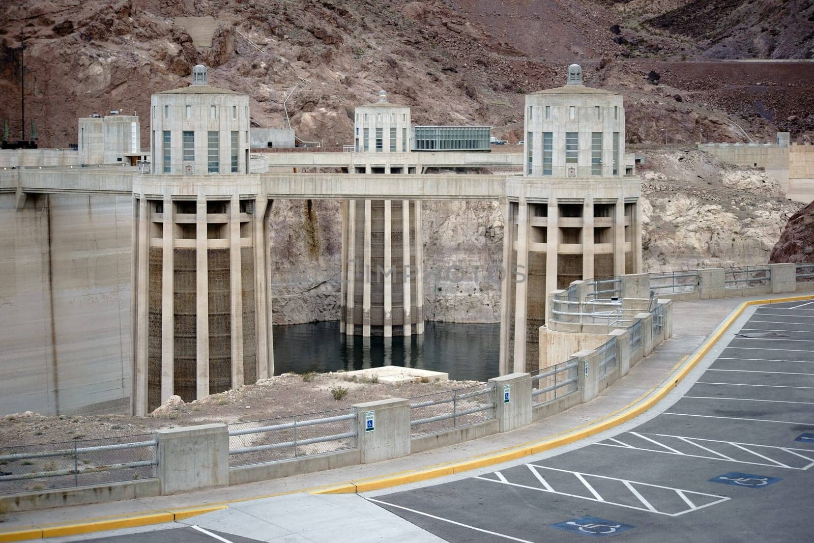 Boulder,United States - December 23,2015: Three water inlet towers of the Hoover Dam stand in a reservoir in front of rocks on December 23,2015 in Boulder.