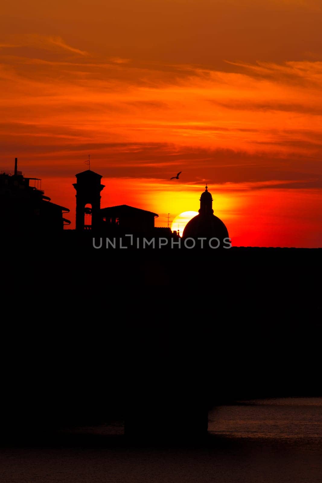 sunset over the ponte vecchio in florence,Italy