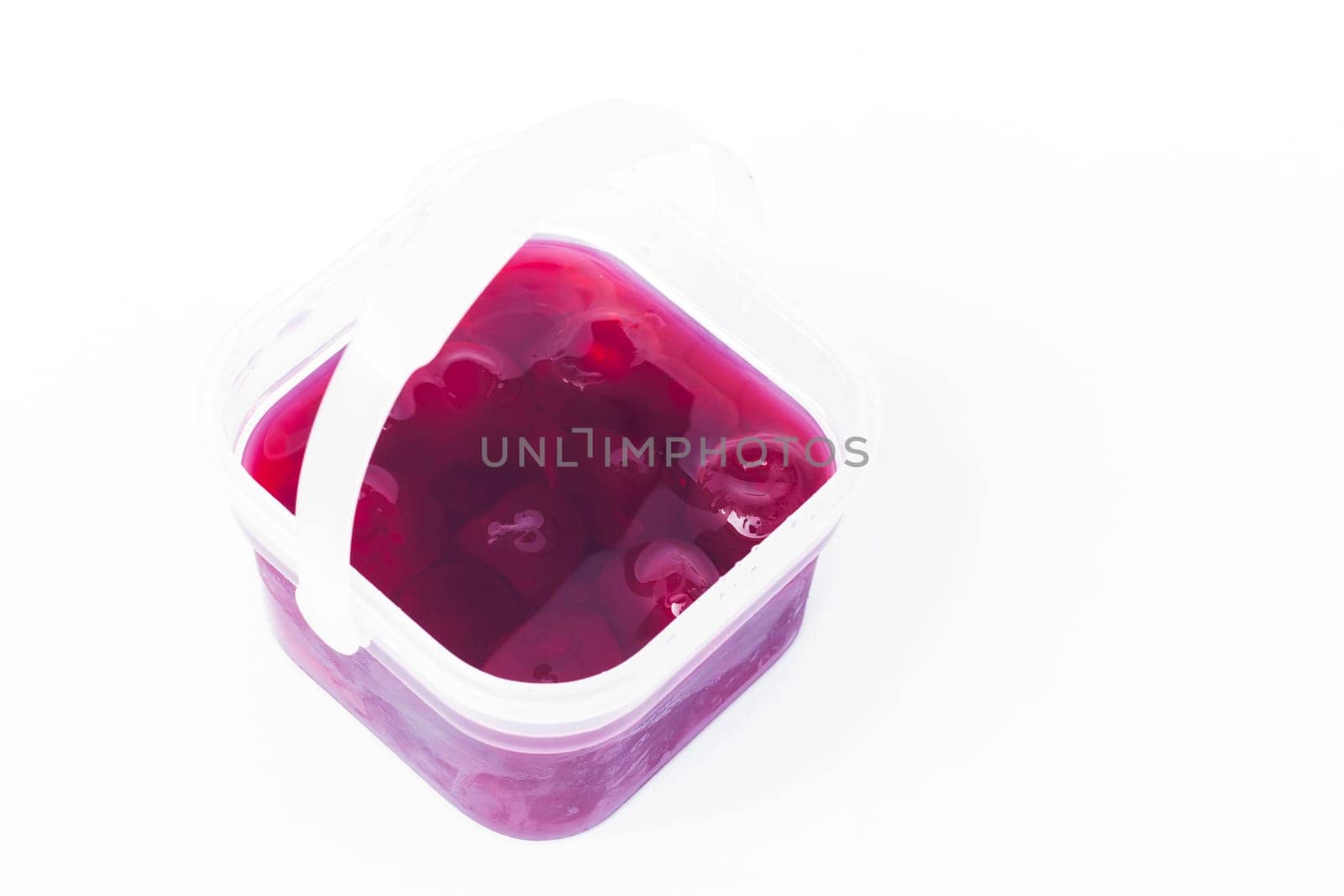 Homemade cherry syrup isolated on white background, stock photo