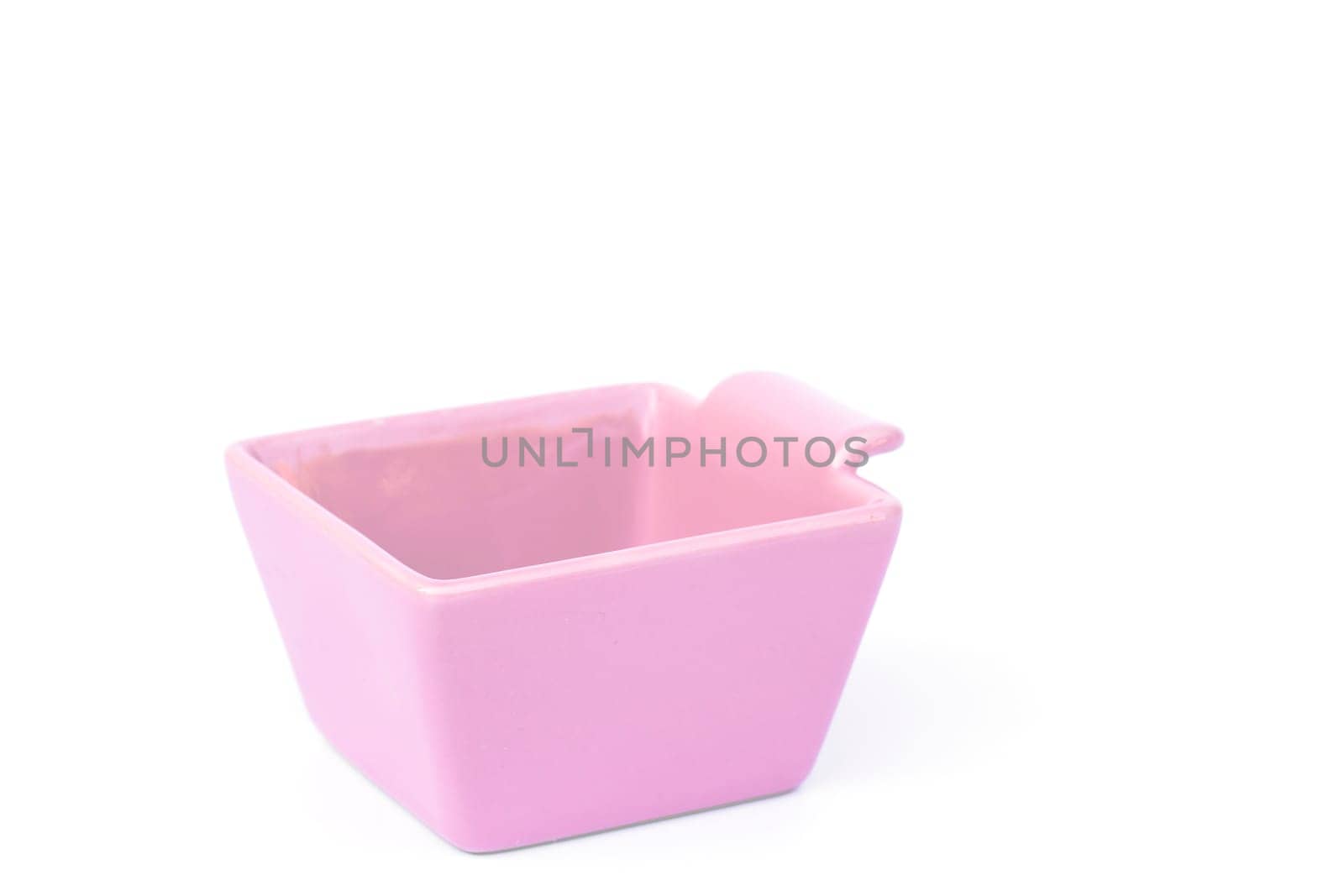 Pink ceramic bowl isolated on white background, stock photo