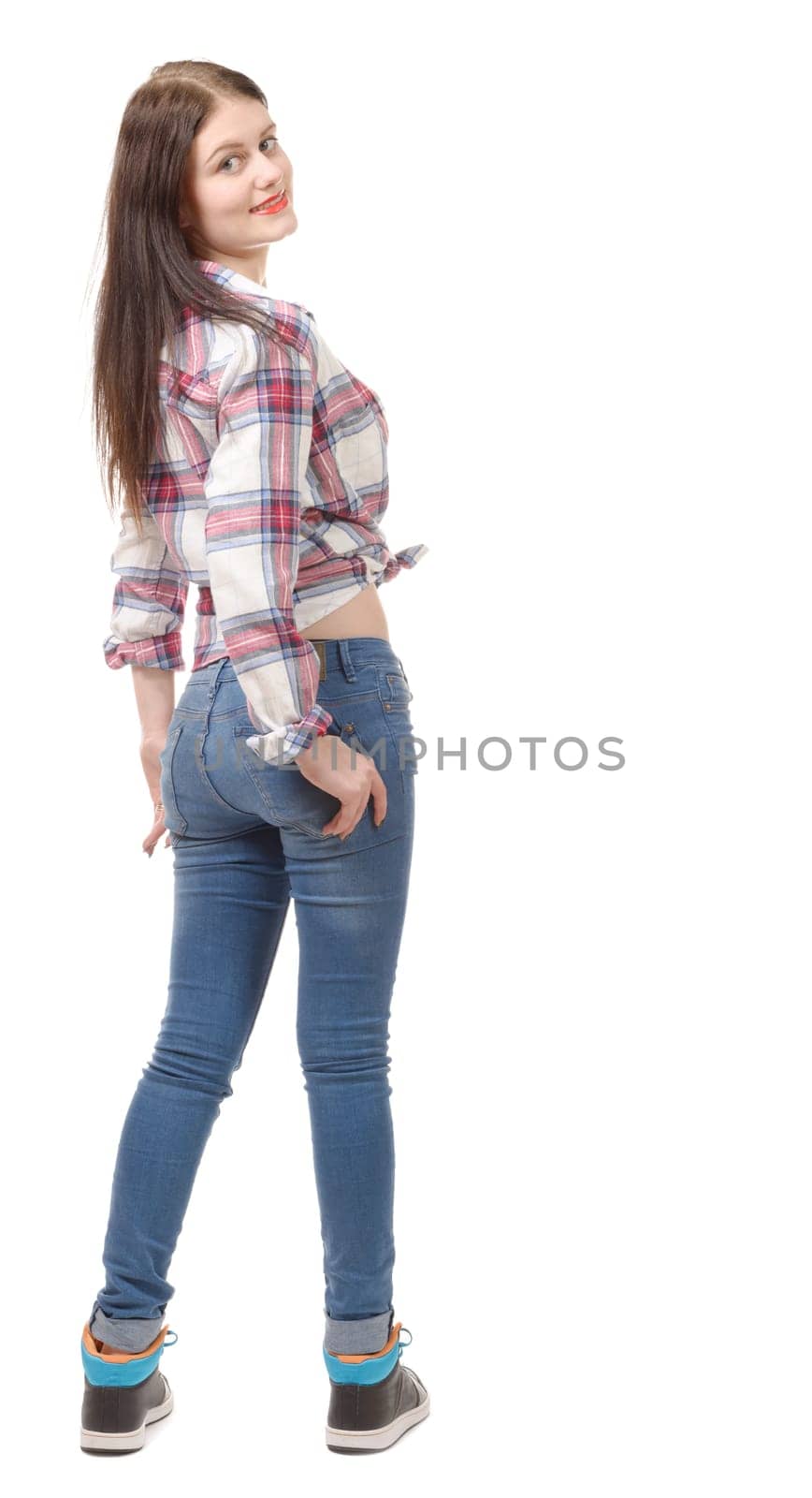 a pretty young woman standing on white background, back view