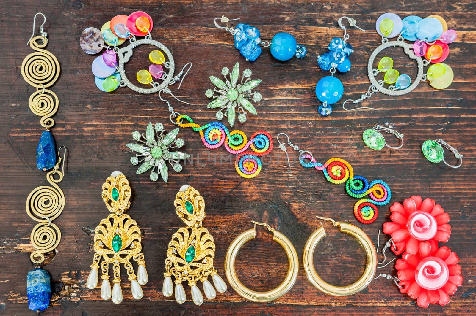 Women's jewellery. Various types of earrings very colourful.