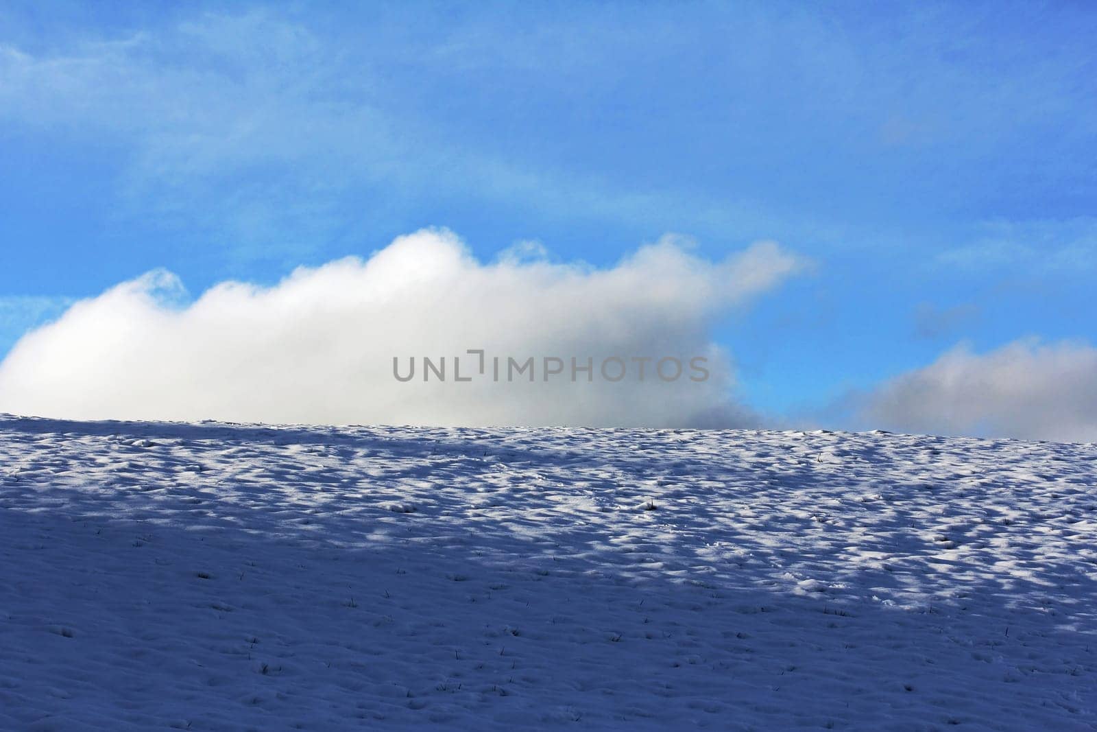 Sky and clouds above the wintry field