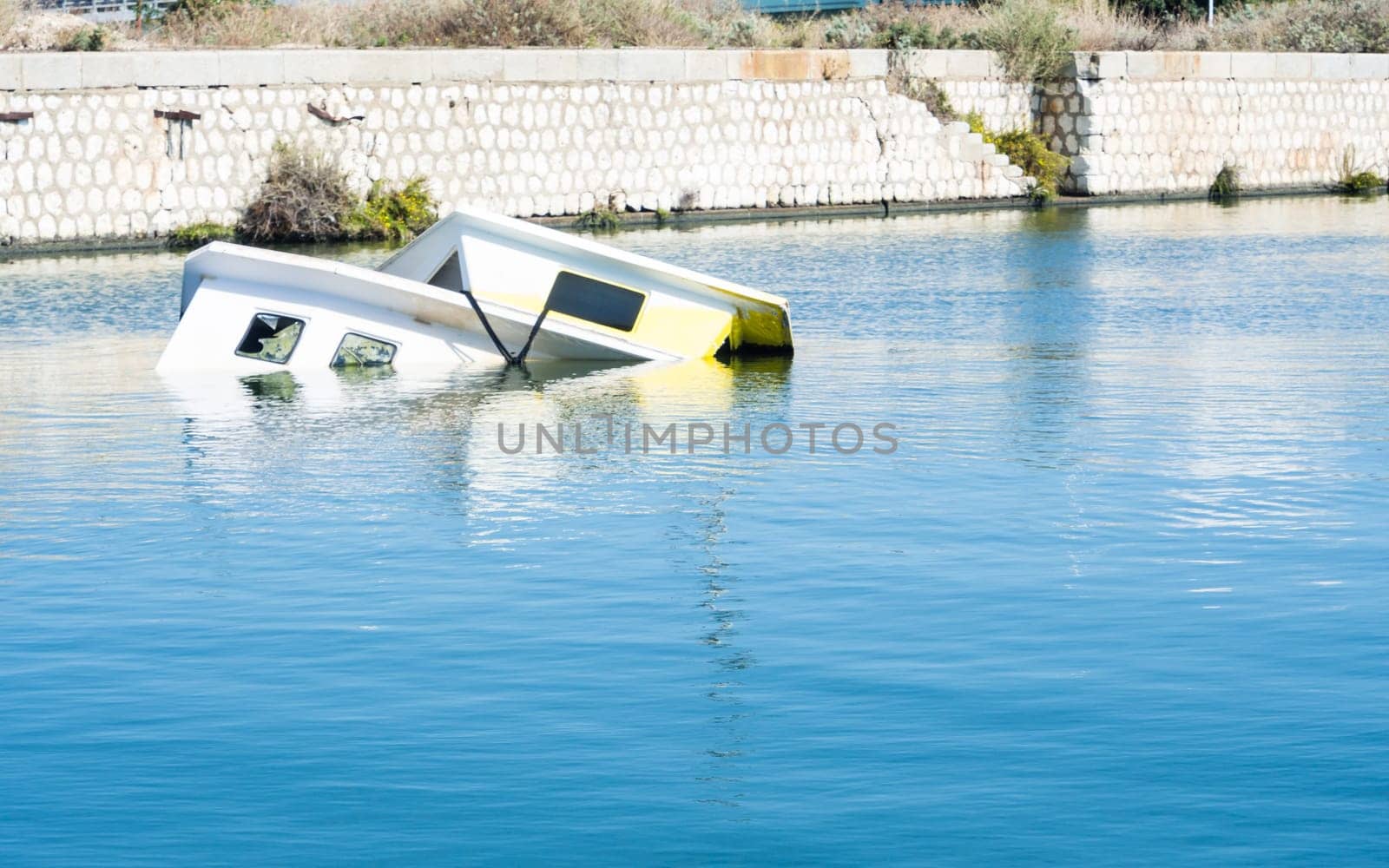 Shipwreck at the pier. harbor of Cagliari - Sardinia.