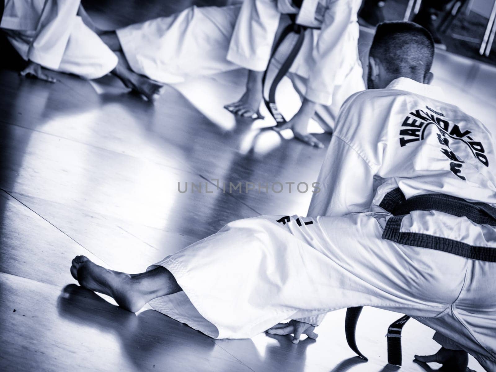 master trains his students. Training of Taekwon-do for kids