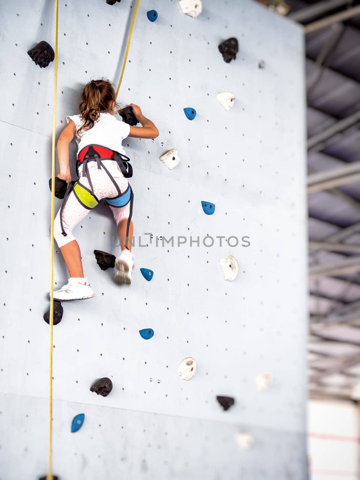 free climbing kids. Demonstration of training of indoor free climbing