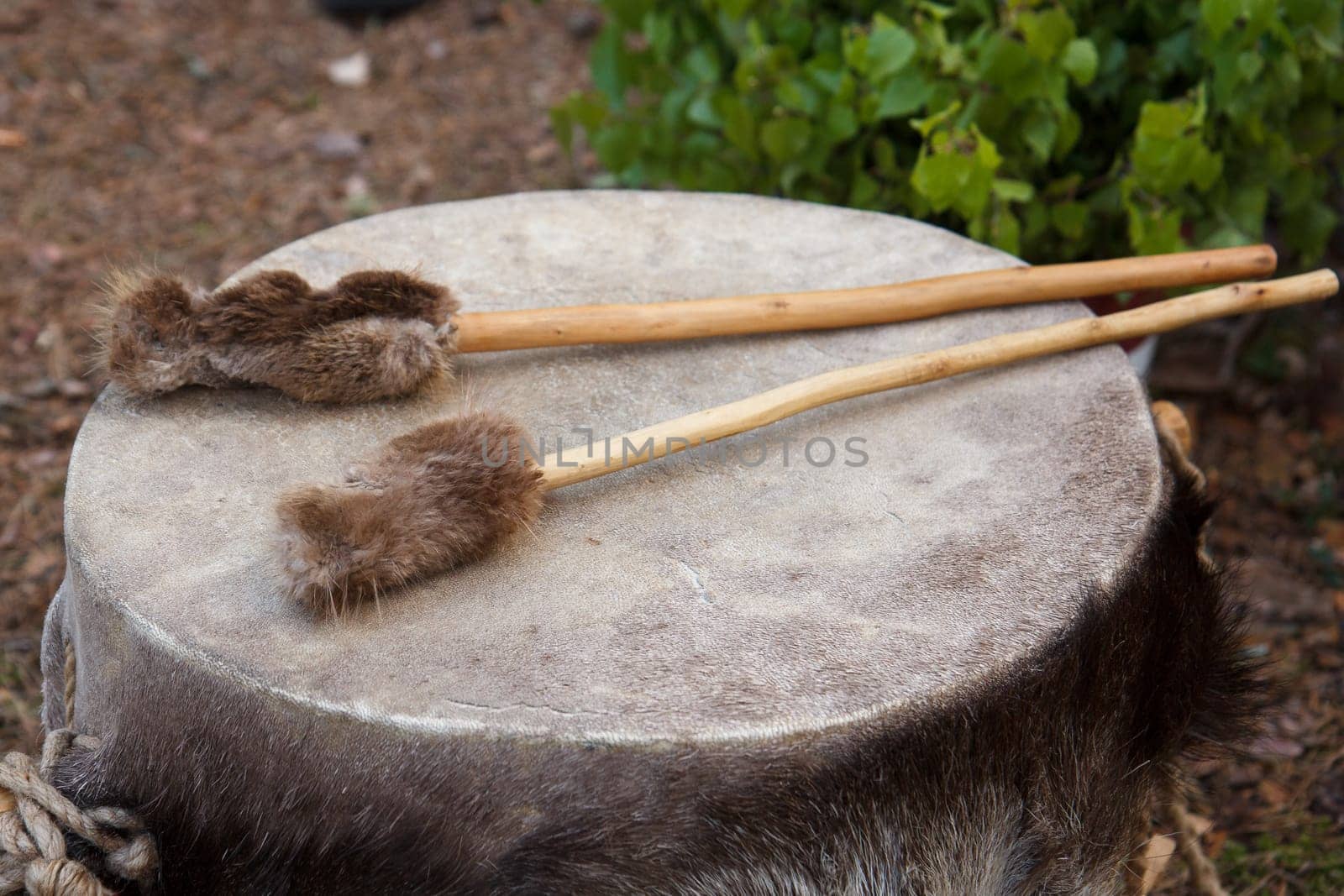 A set of traditional leather drums outdoors