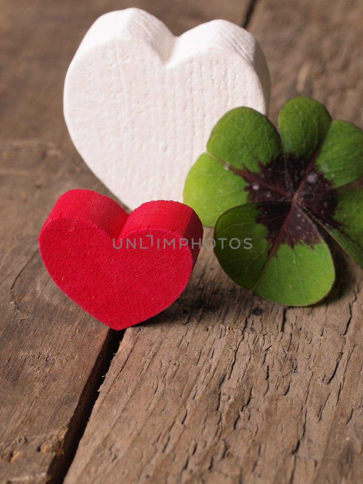 Heart shapes with a clover on a rustic wooden table