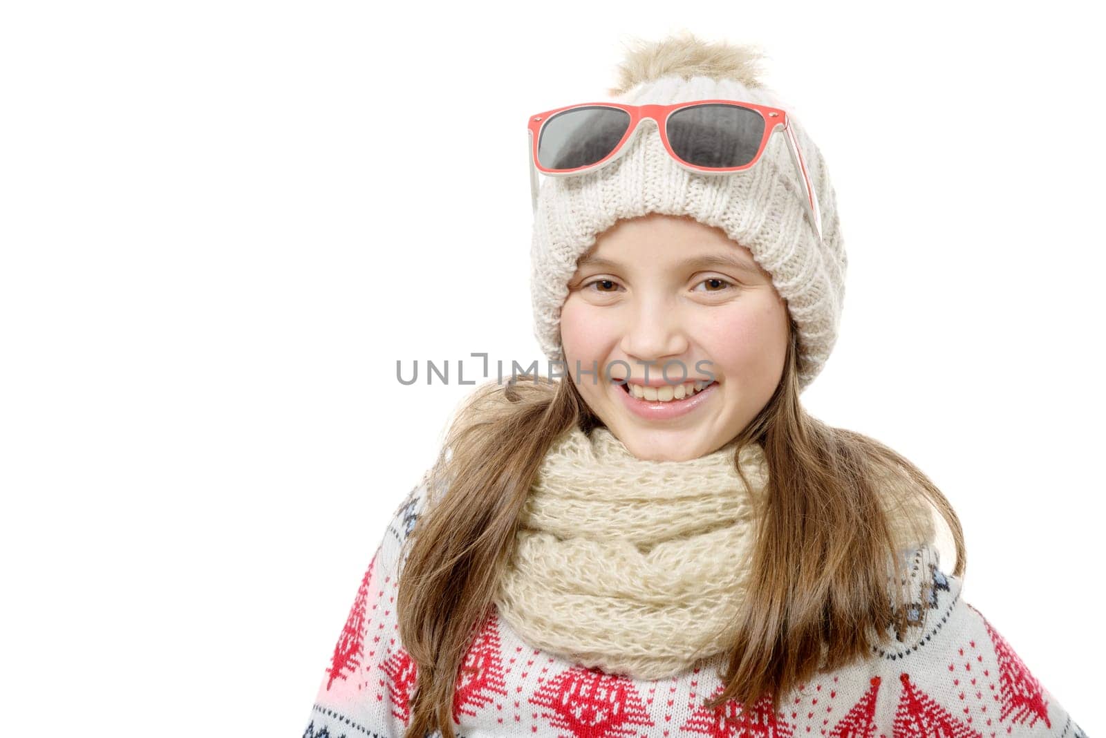 a portrait of a happy young girl snowboarding