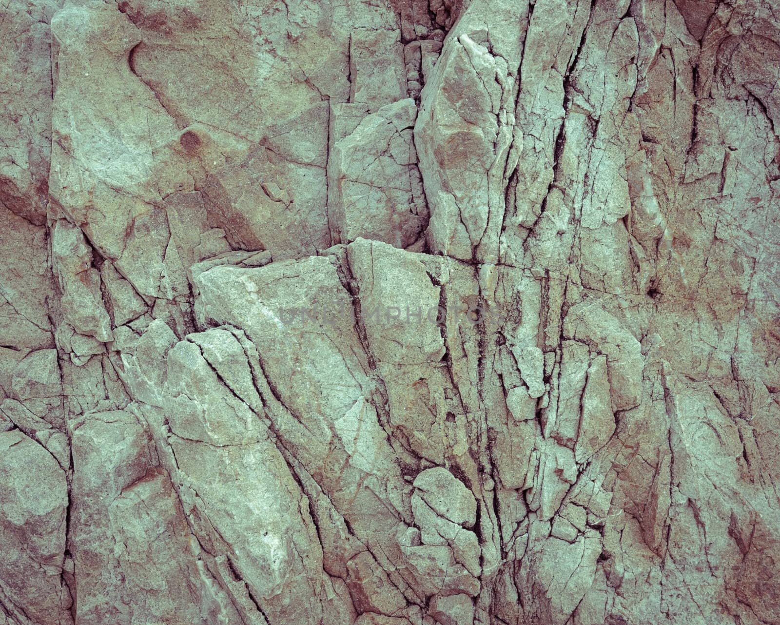 Rough stone rock texture background in vintage filter effect