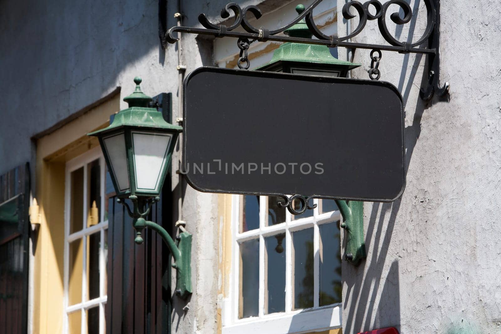 Vintage blank bar or restaurant sign in a picturesque environment