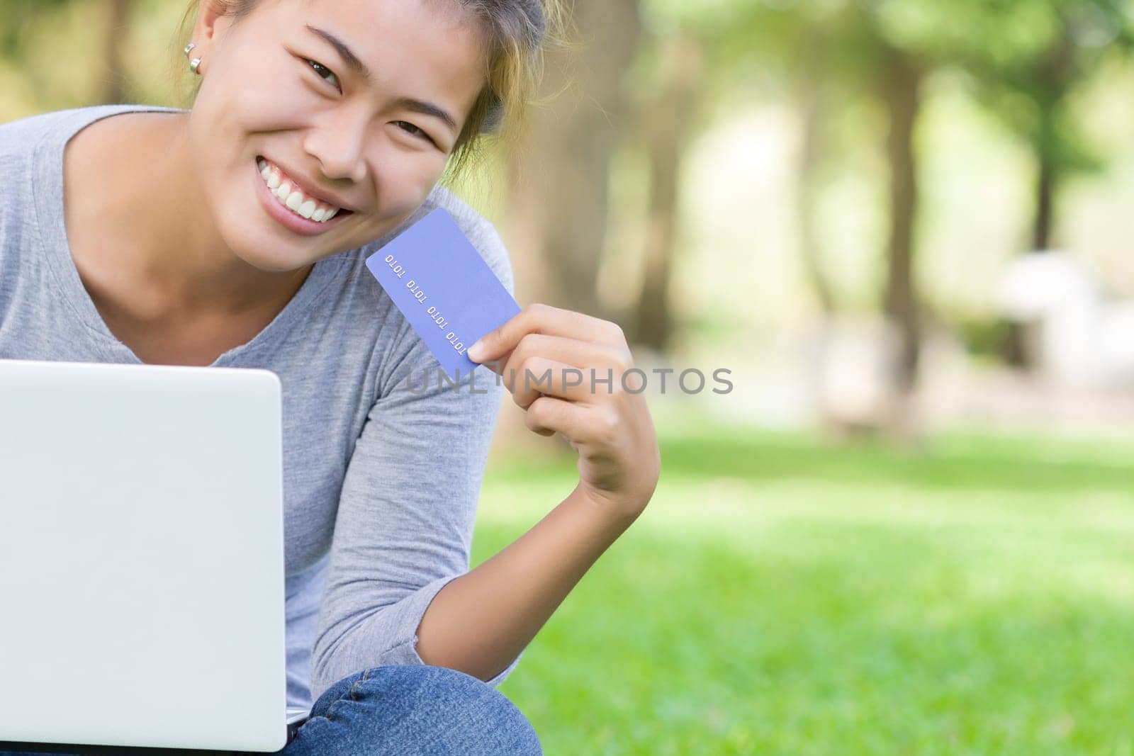 happy woman with credit card and laptop new lifestyle easy payment shopping online