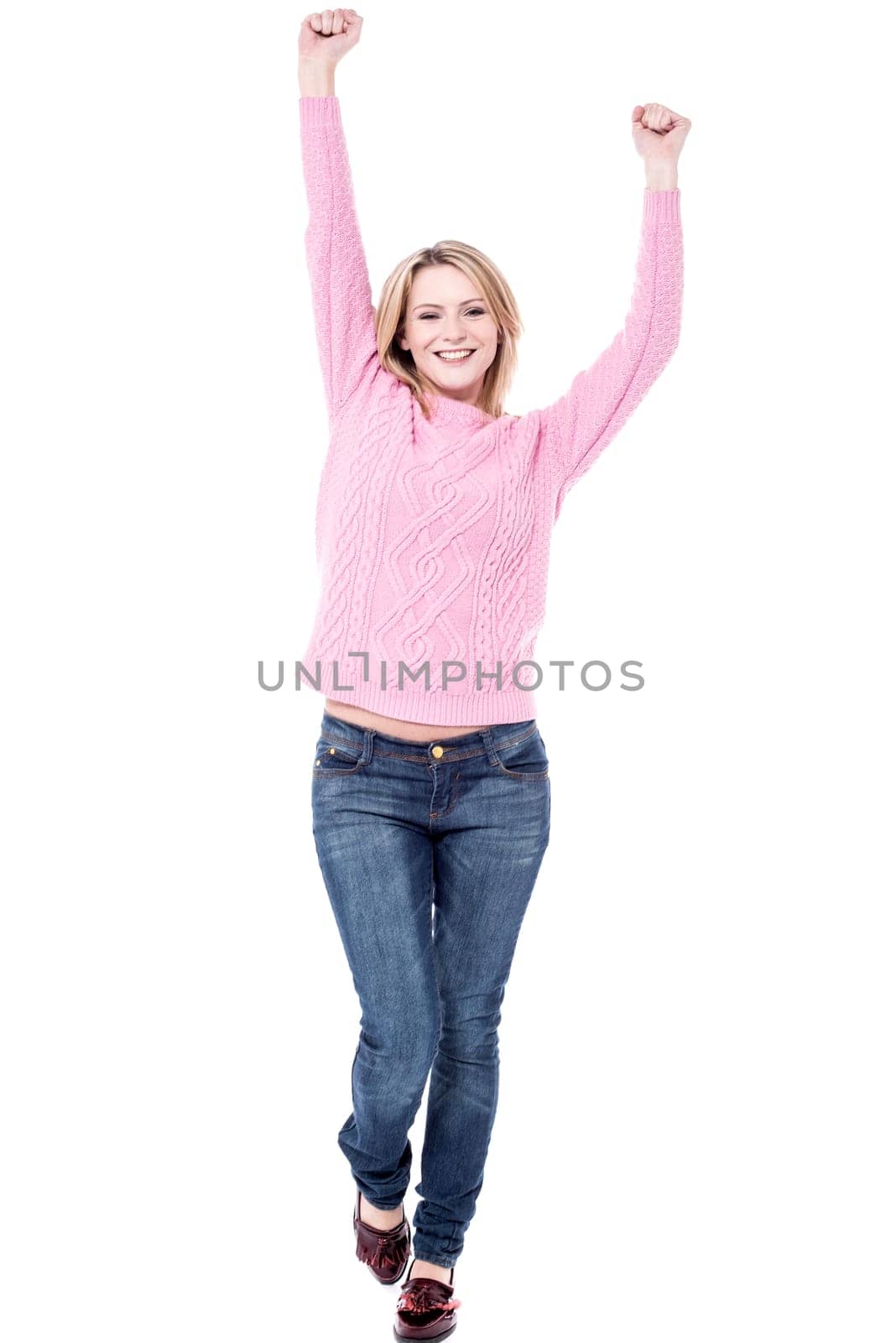 Happy woman raising her arms and celebrating