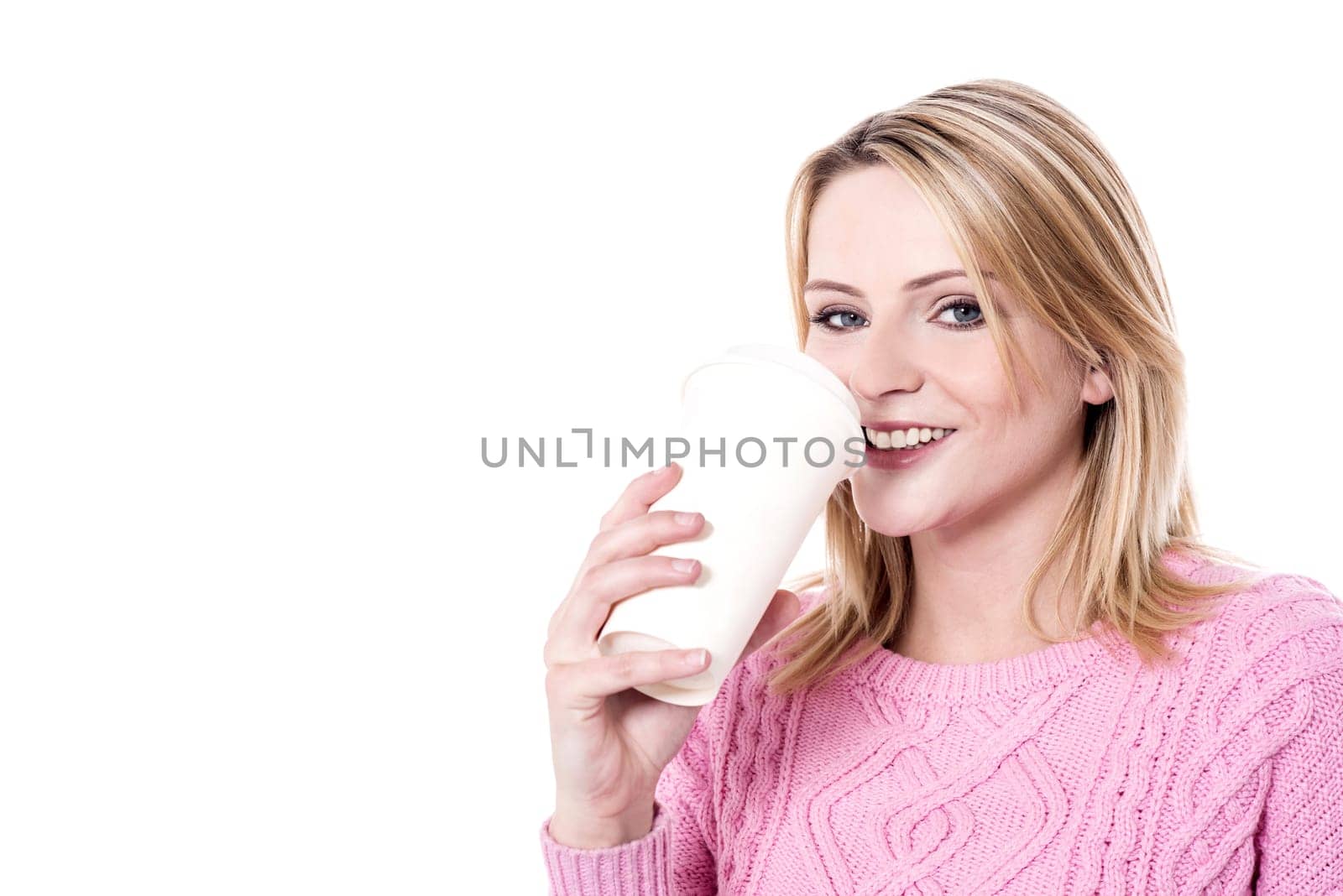 Young smiling woman having beverage