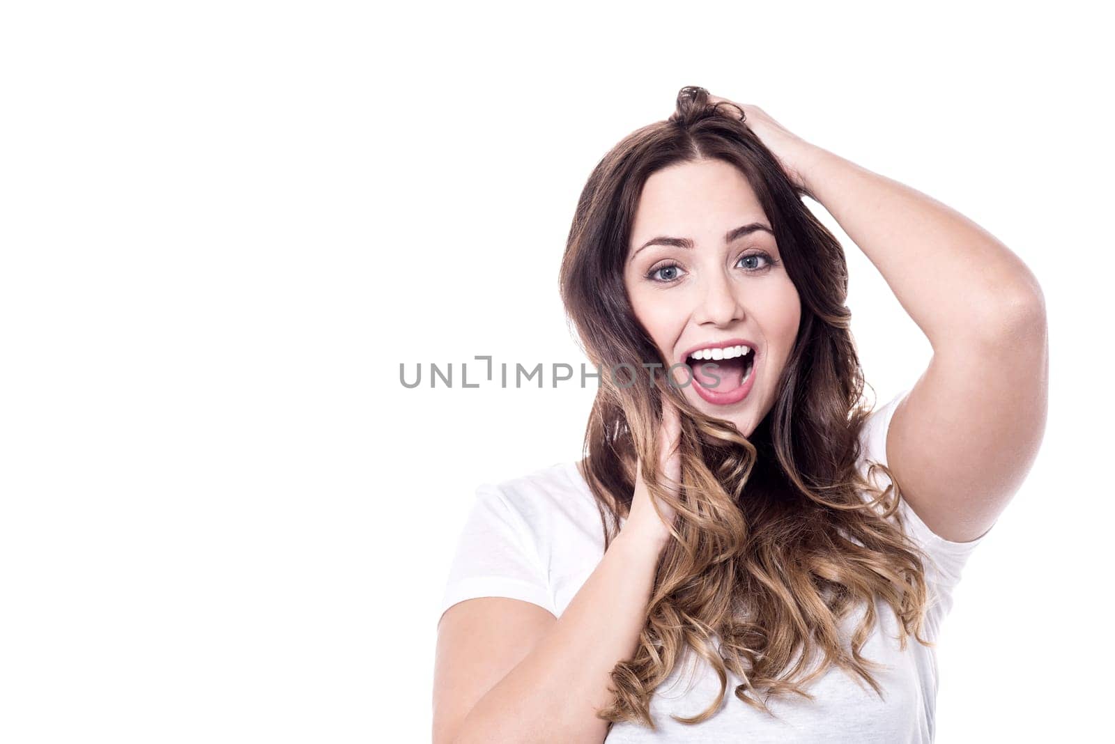Expressive woman looking at camera over white