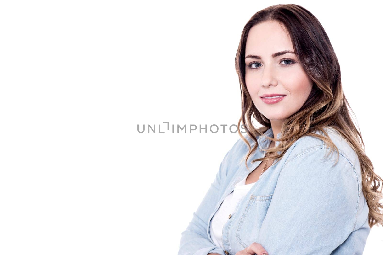 Side pose of a young lady against white background