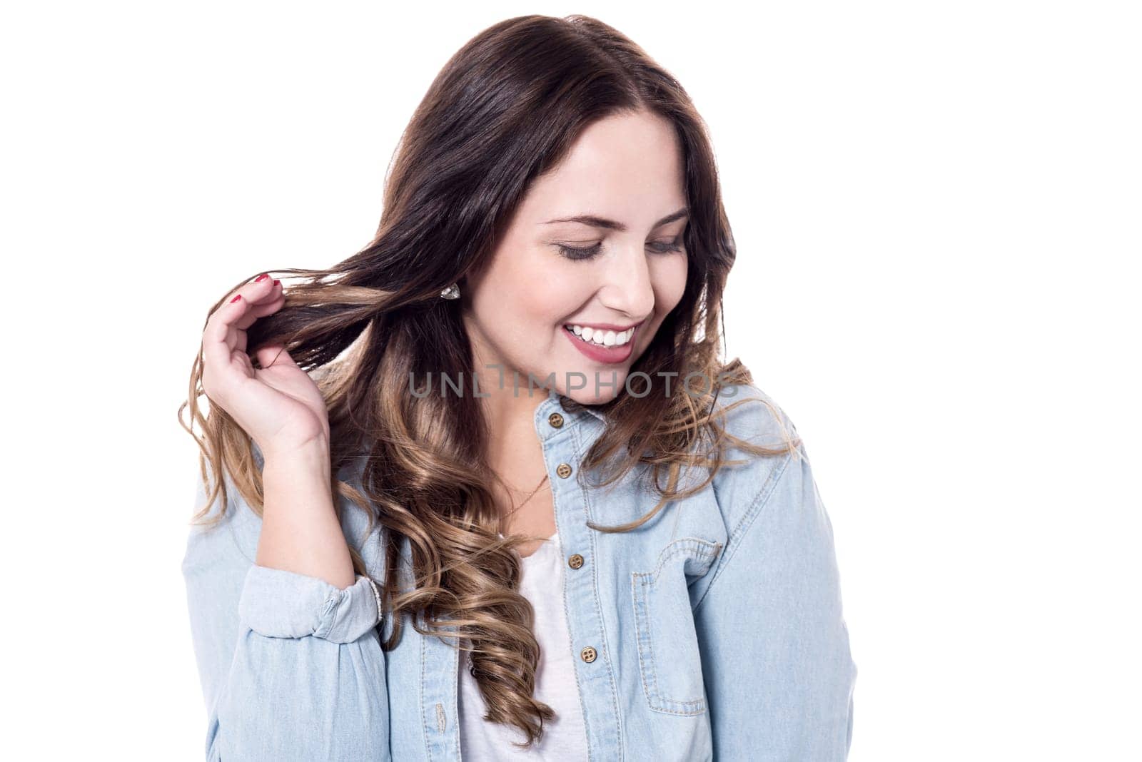 Attractive woman is touching her hair shyly