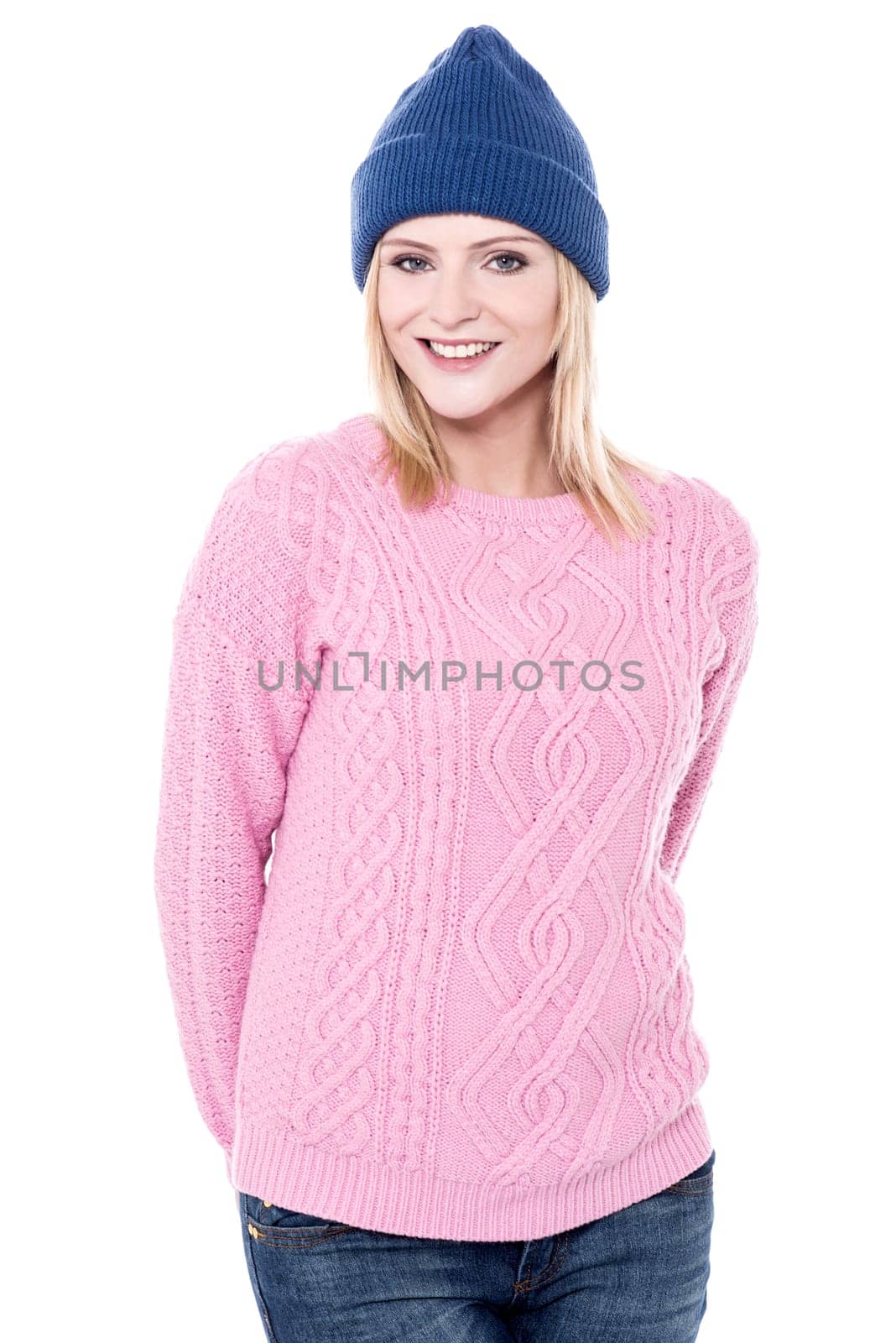 Pretty lady posing with blue winter cap