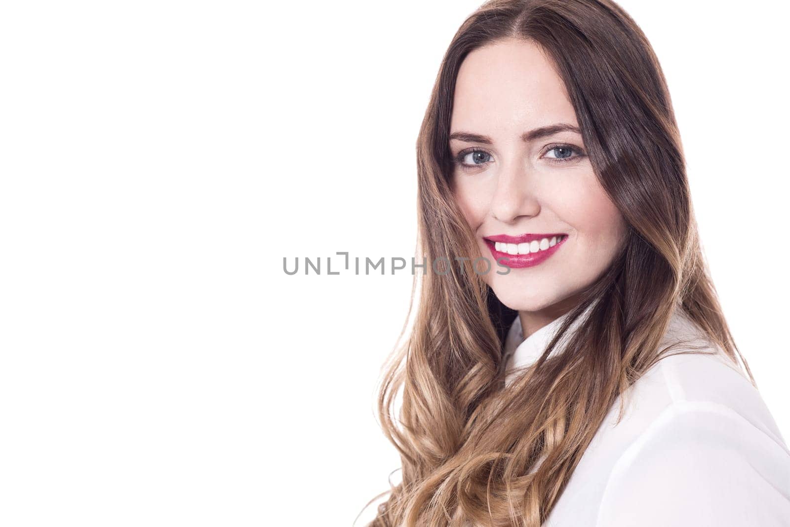 Beautiful woman posing to the camera against white
