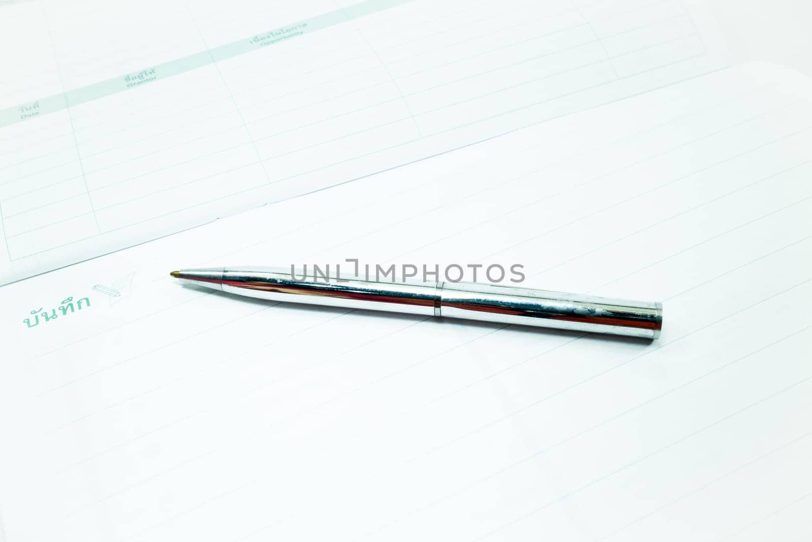 Metallic pen and recording paper, stock photo