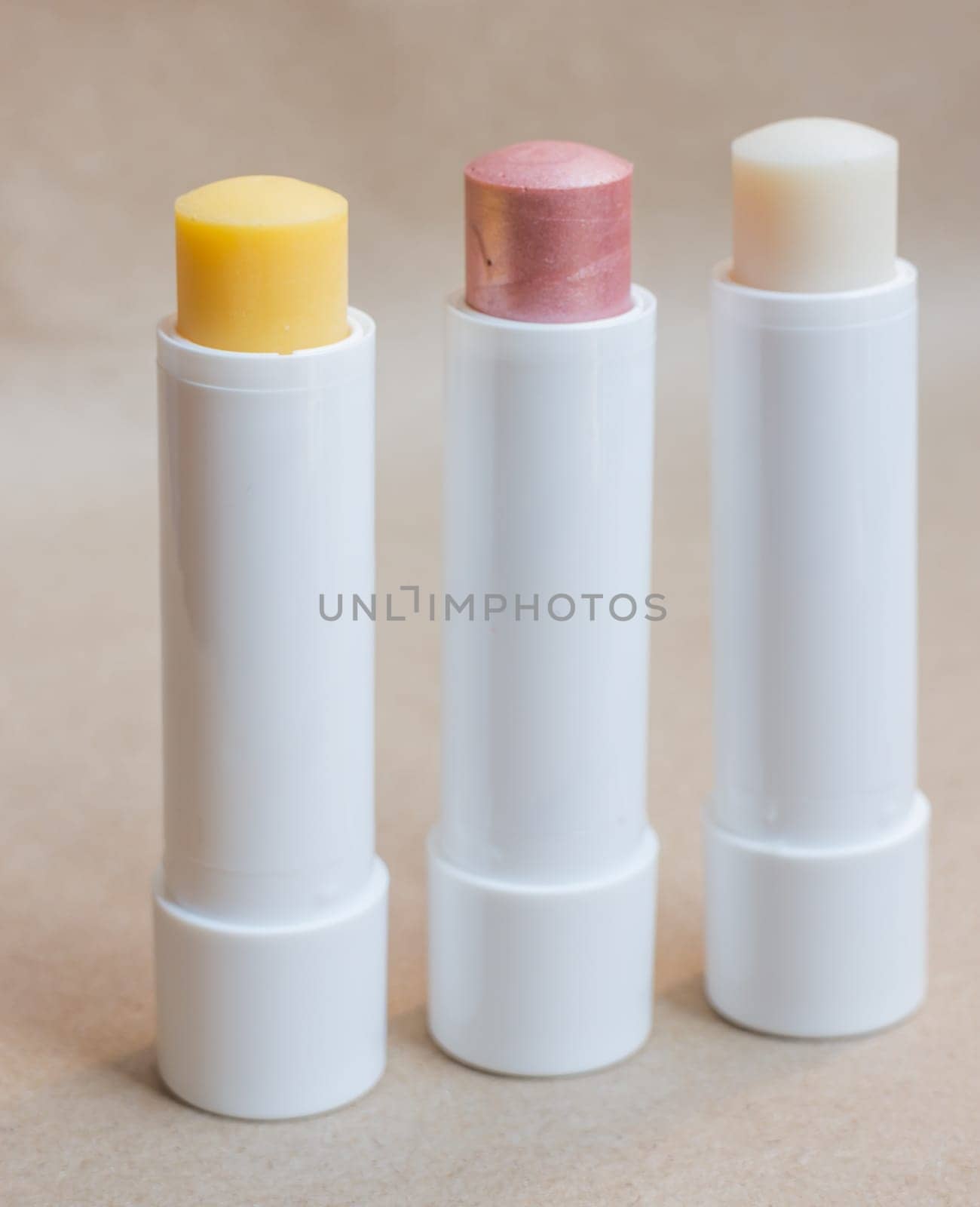 Moisturizer lipstick on brown natural background, stock photo