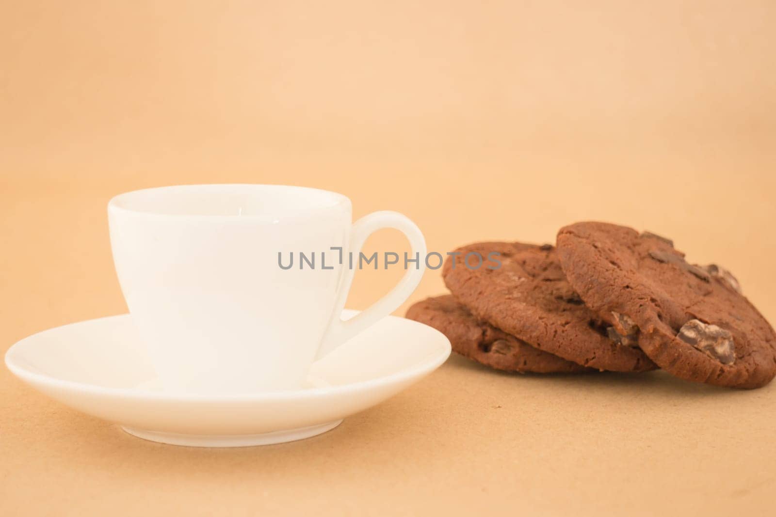 White mug of hot coffee and chocolate cookies, stock photo