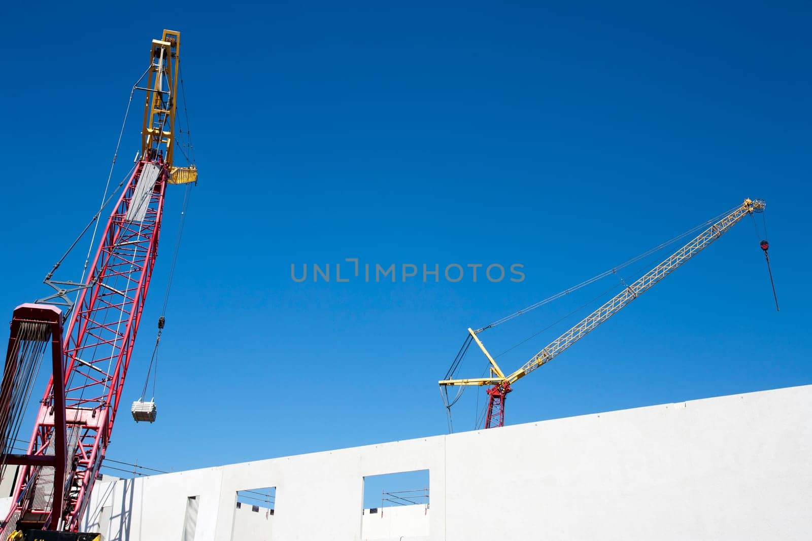 Crane lifting construction materials